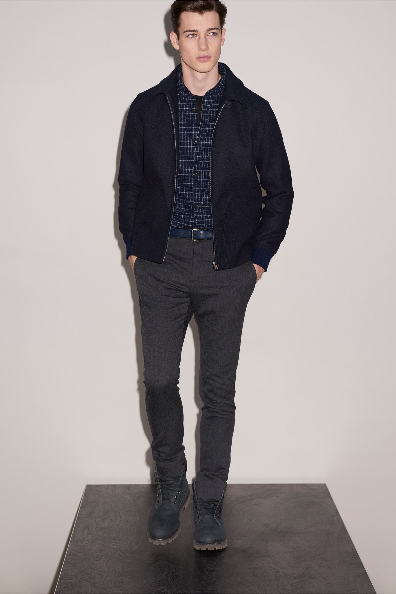 black jacket blue shirt gray pants
