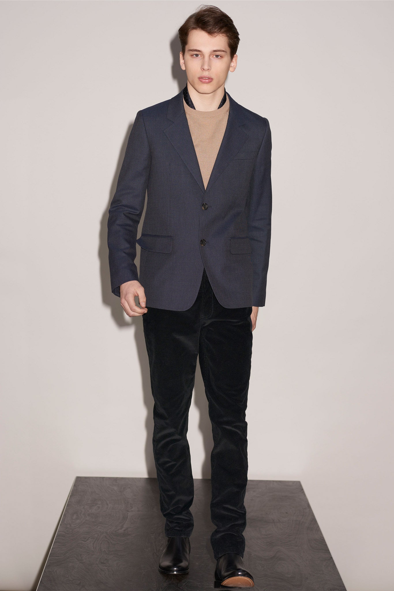 navy blazer beige sweater black pants