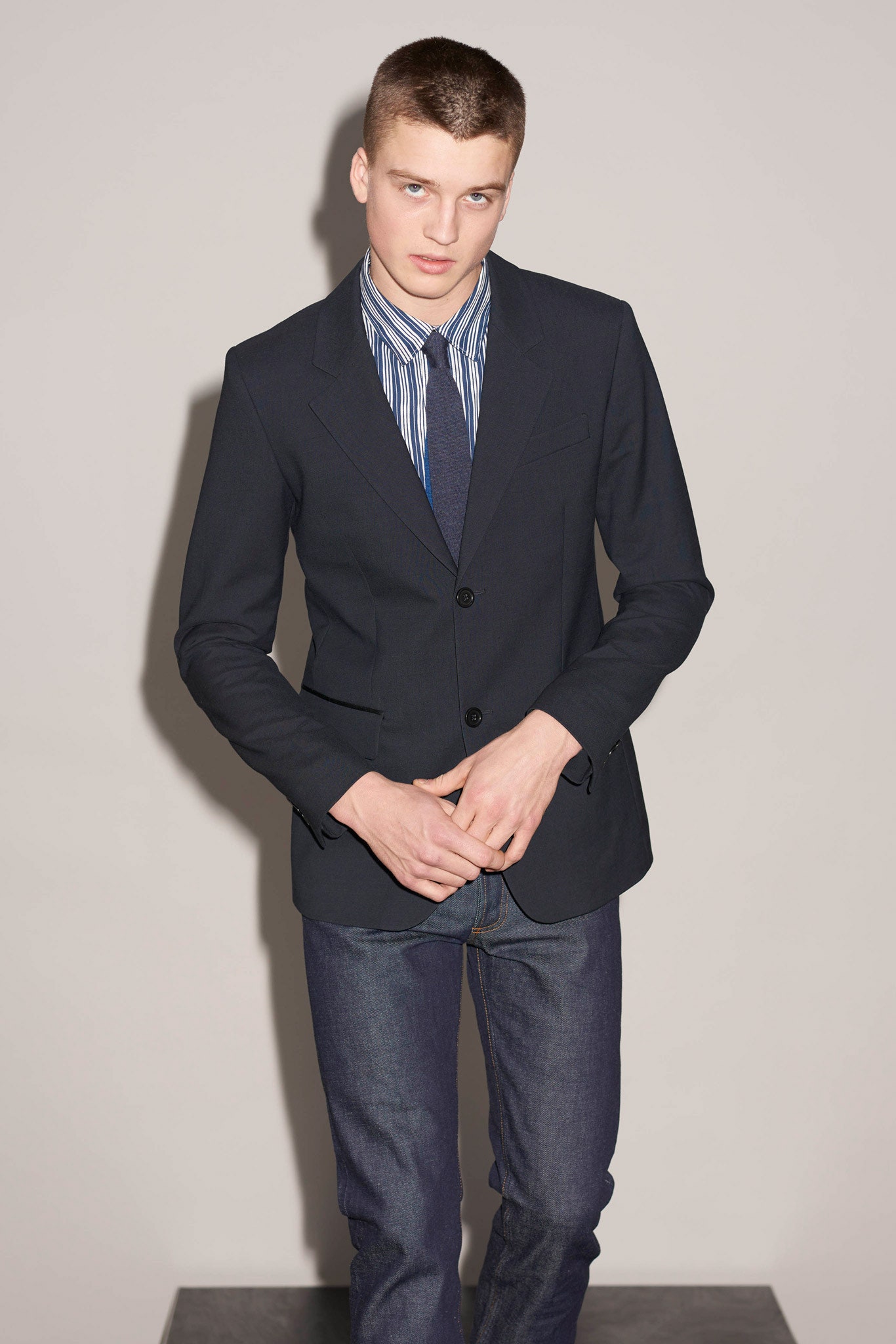 black tailored blazer with striped shirt