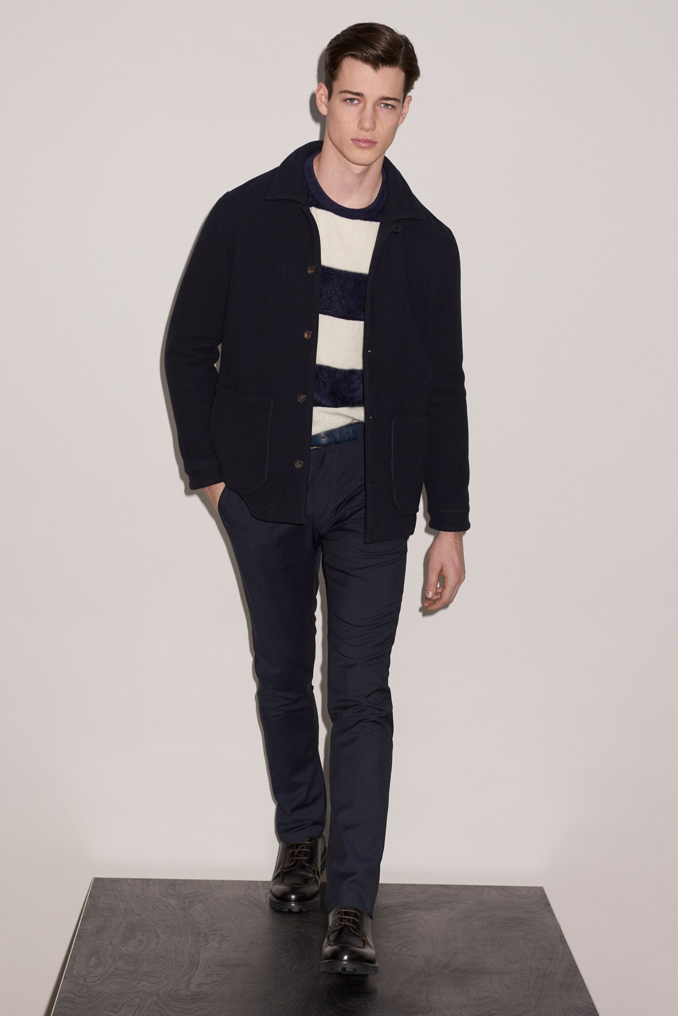 black wool jacket with striped sweater