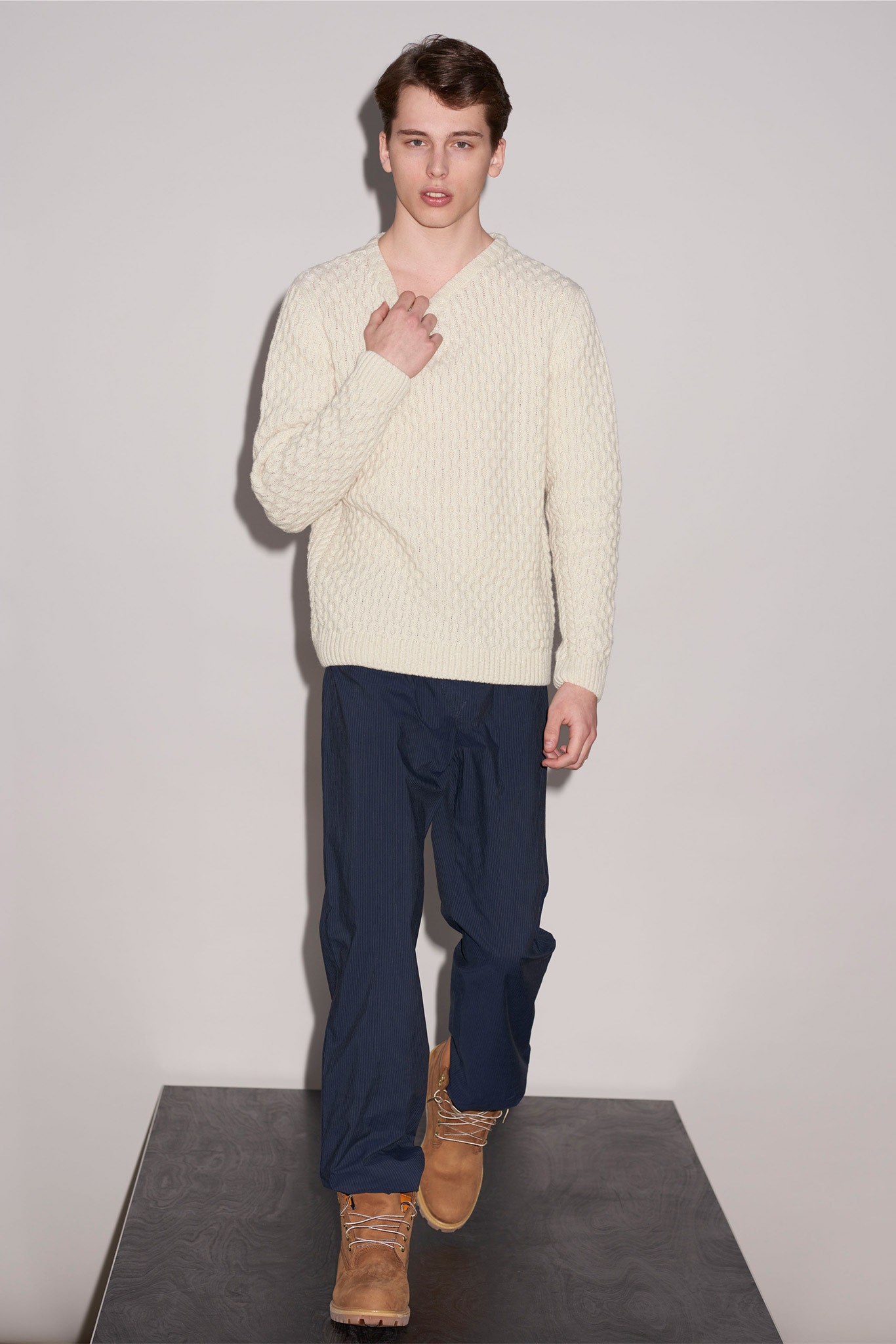 white fitted sweater with blue pants