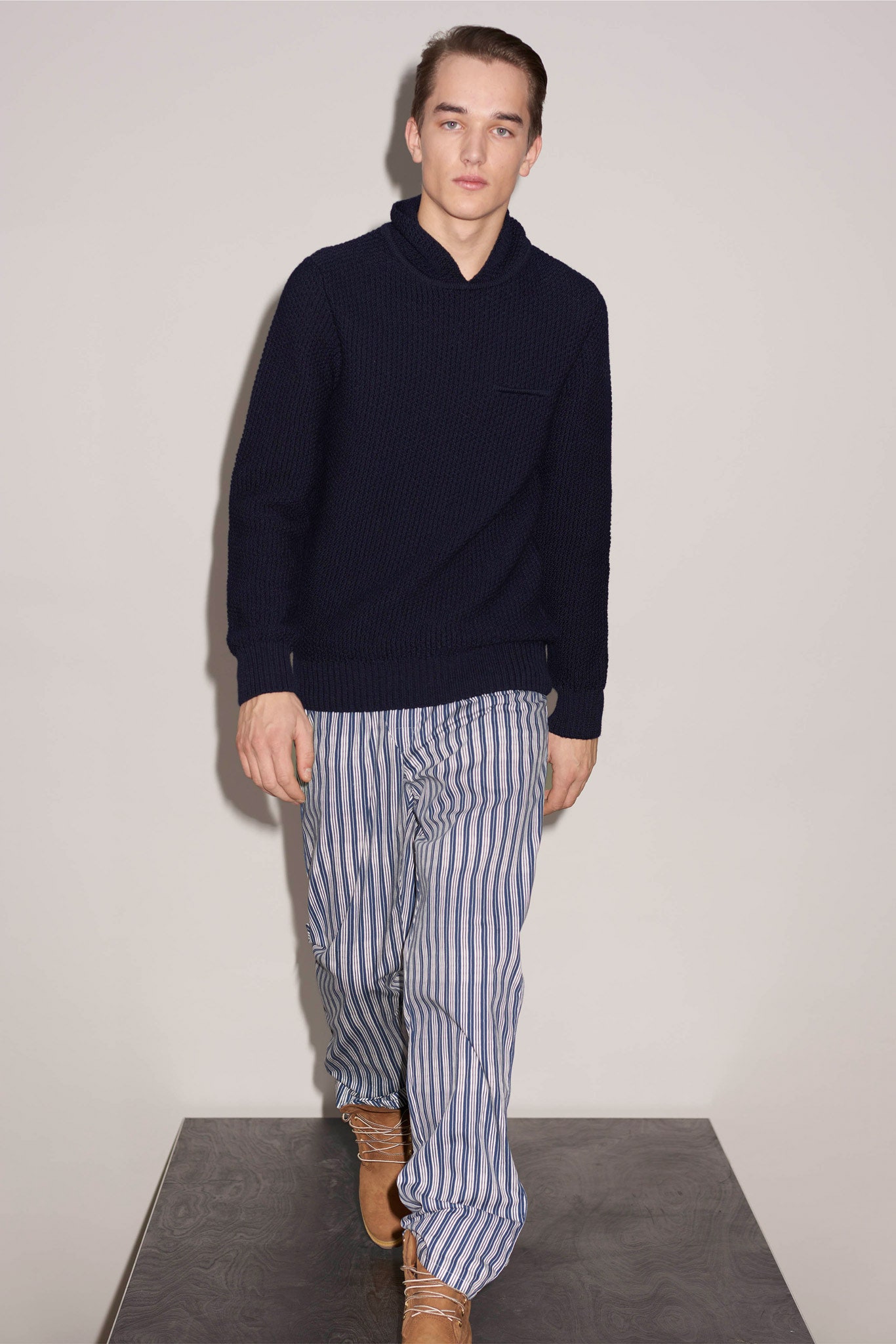 navy sweater with striped pants