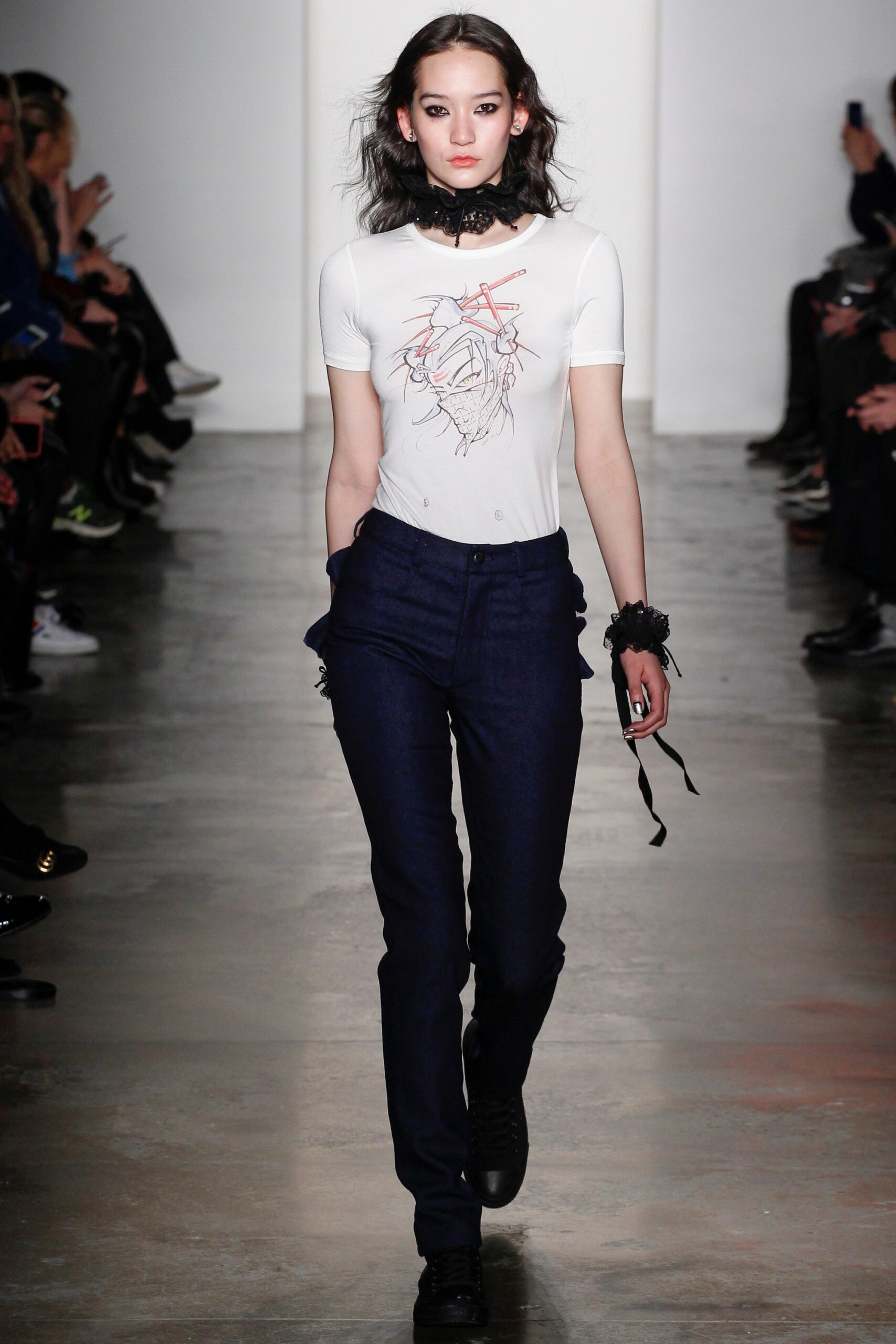 white fitted top with embroidered design