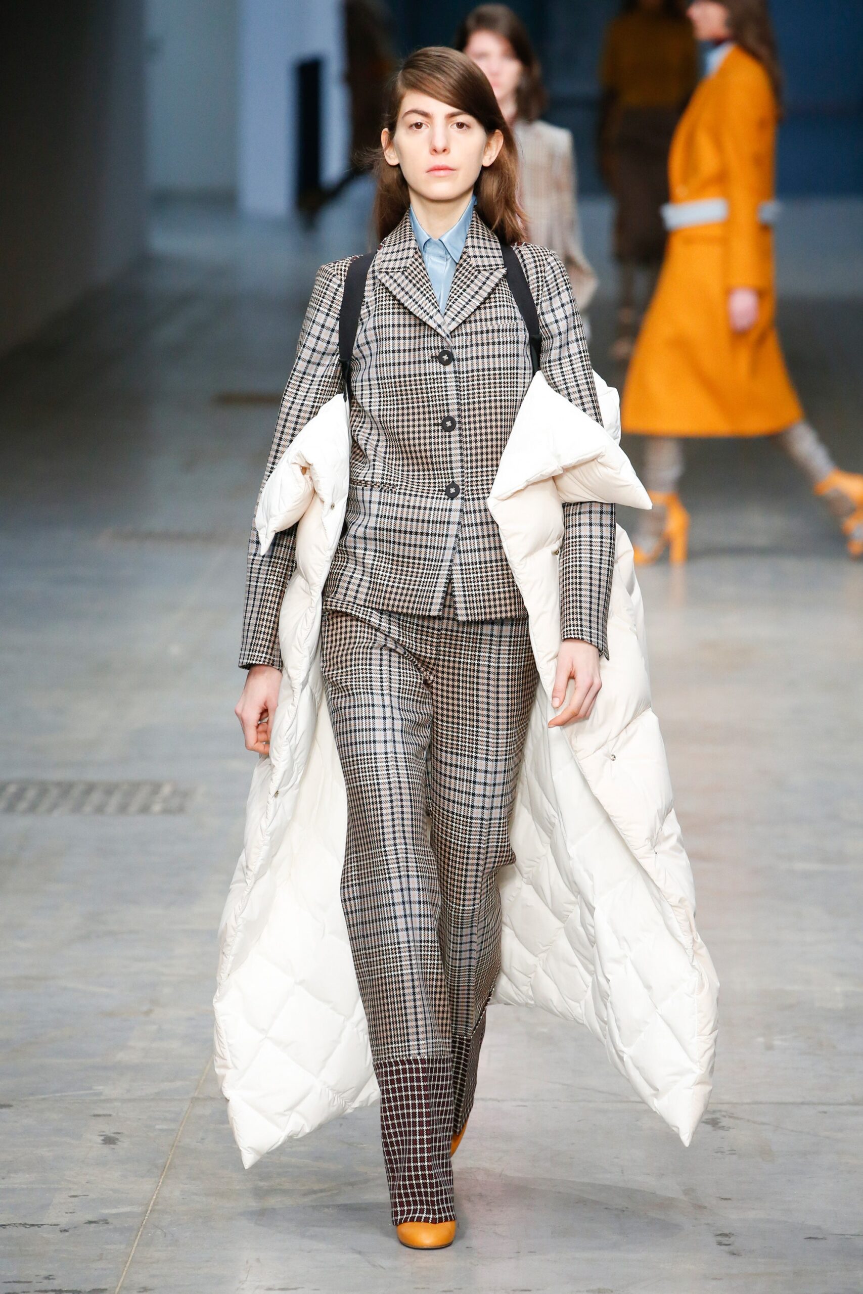 gray checked tailored suit with white coat