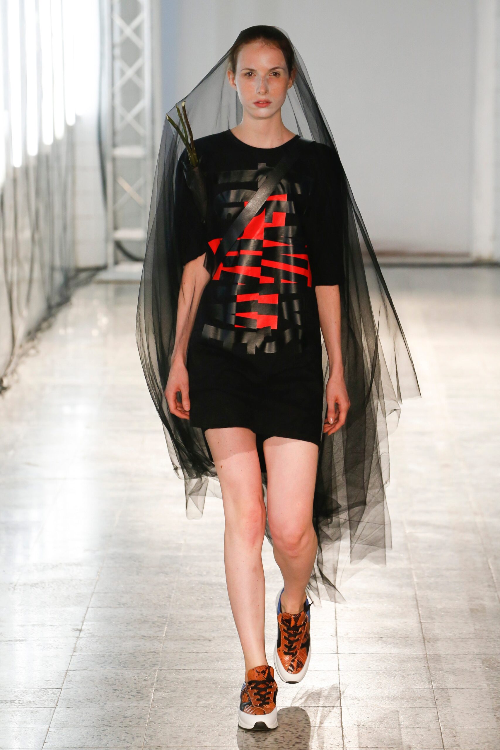 black t-shirt and skirt with veil