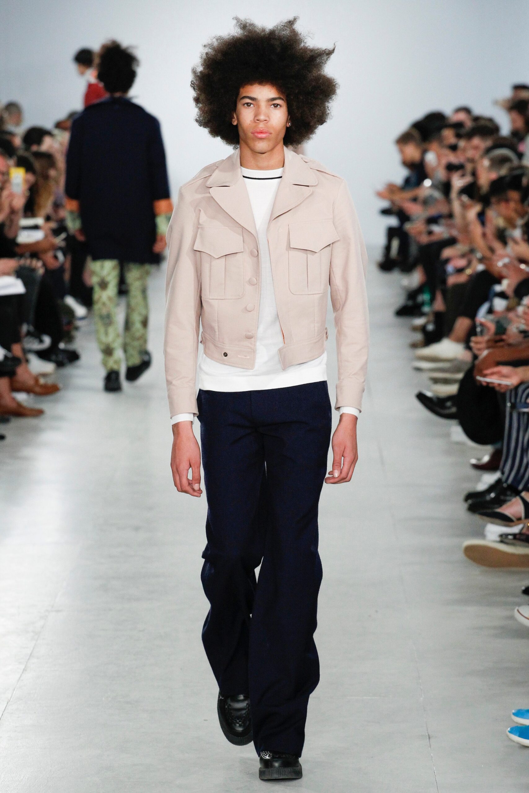 beige jacket with white t-shirt and navy pants