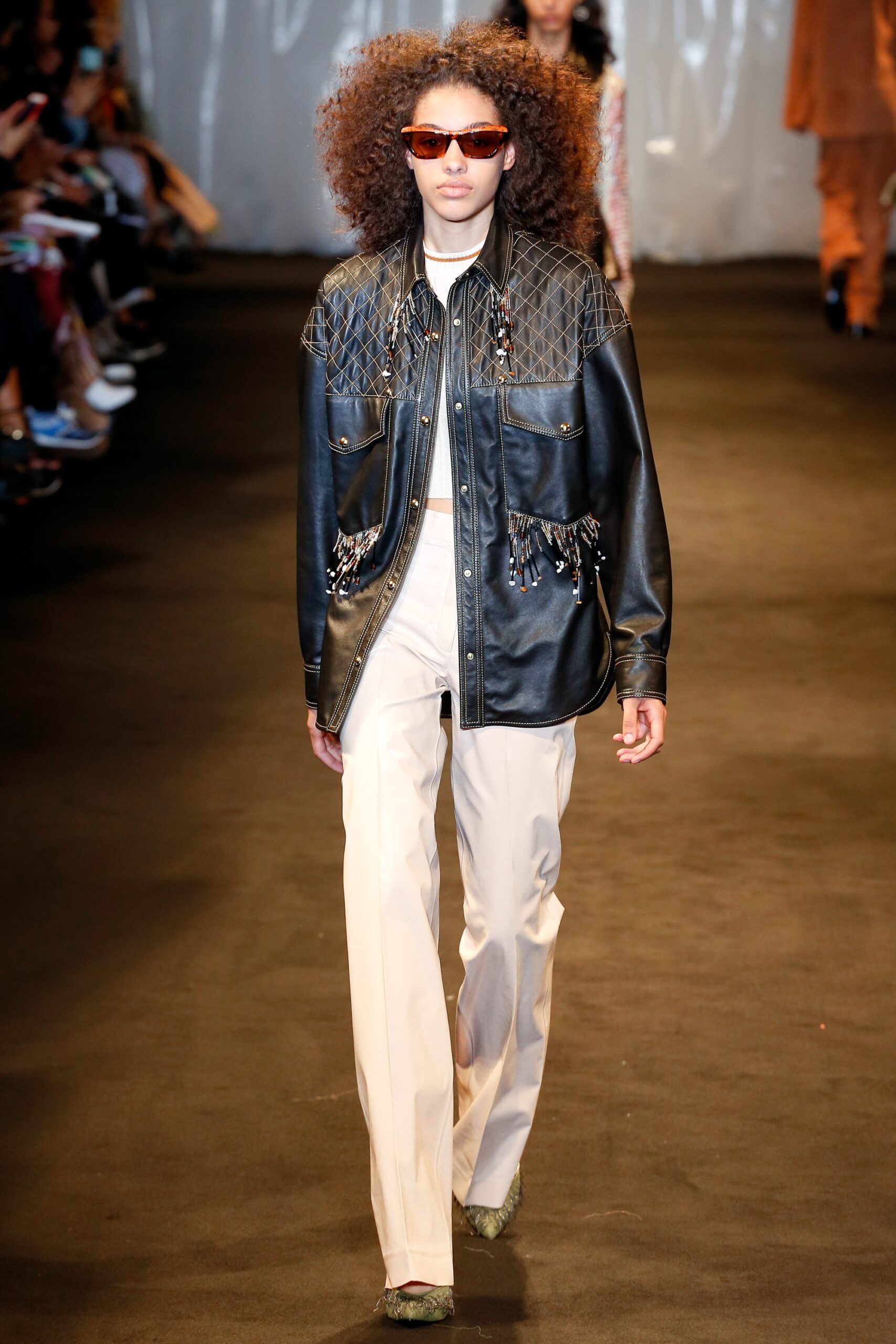 black leather long-sleeve collared fitted fringed zippered jacket