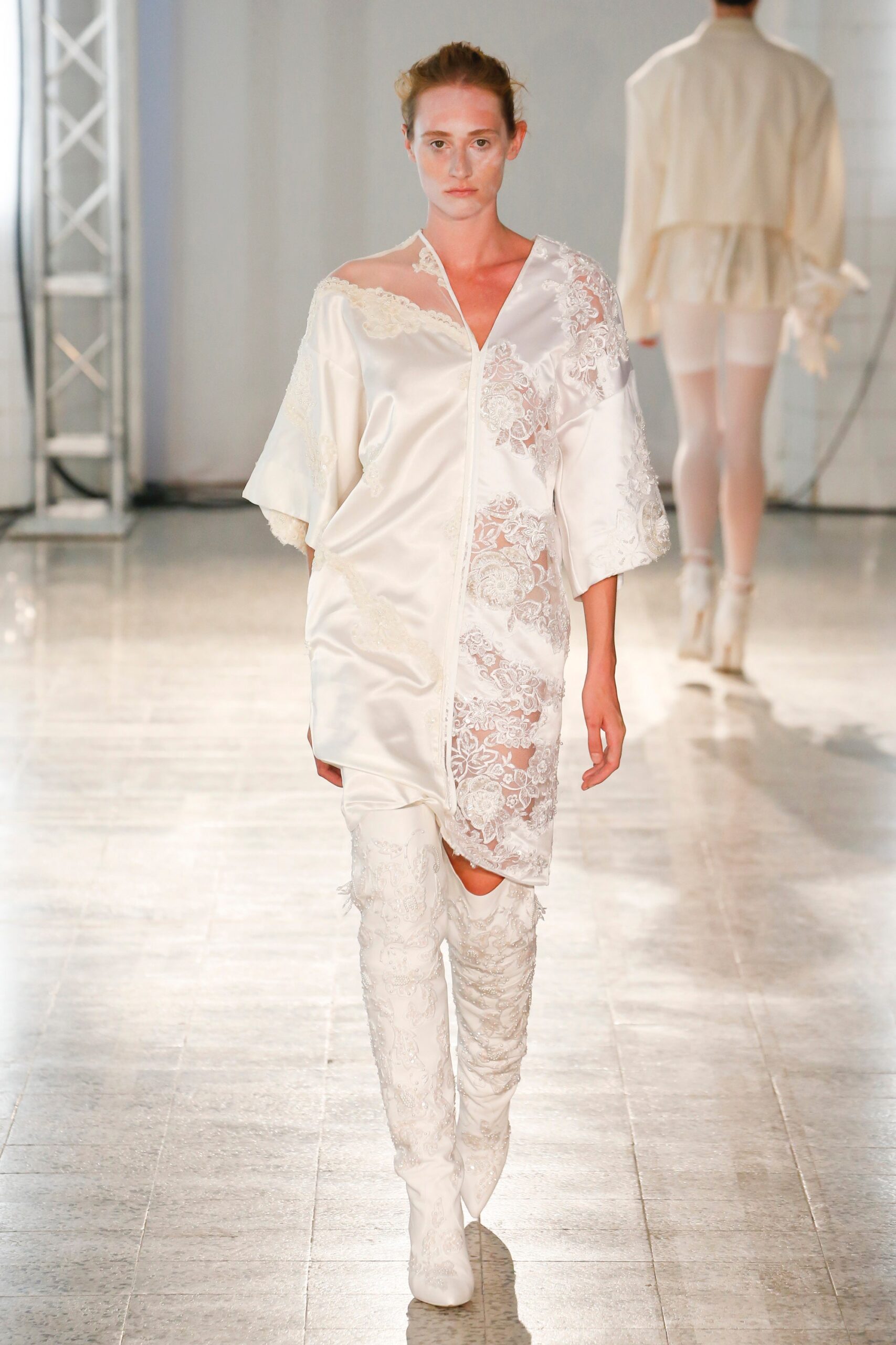 white embroidered dress and boots