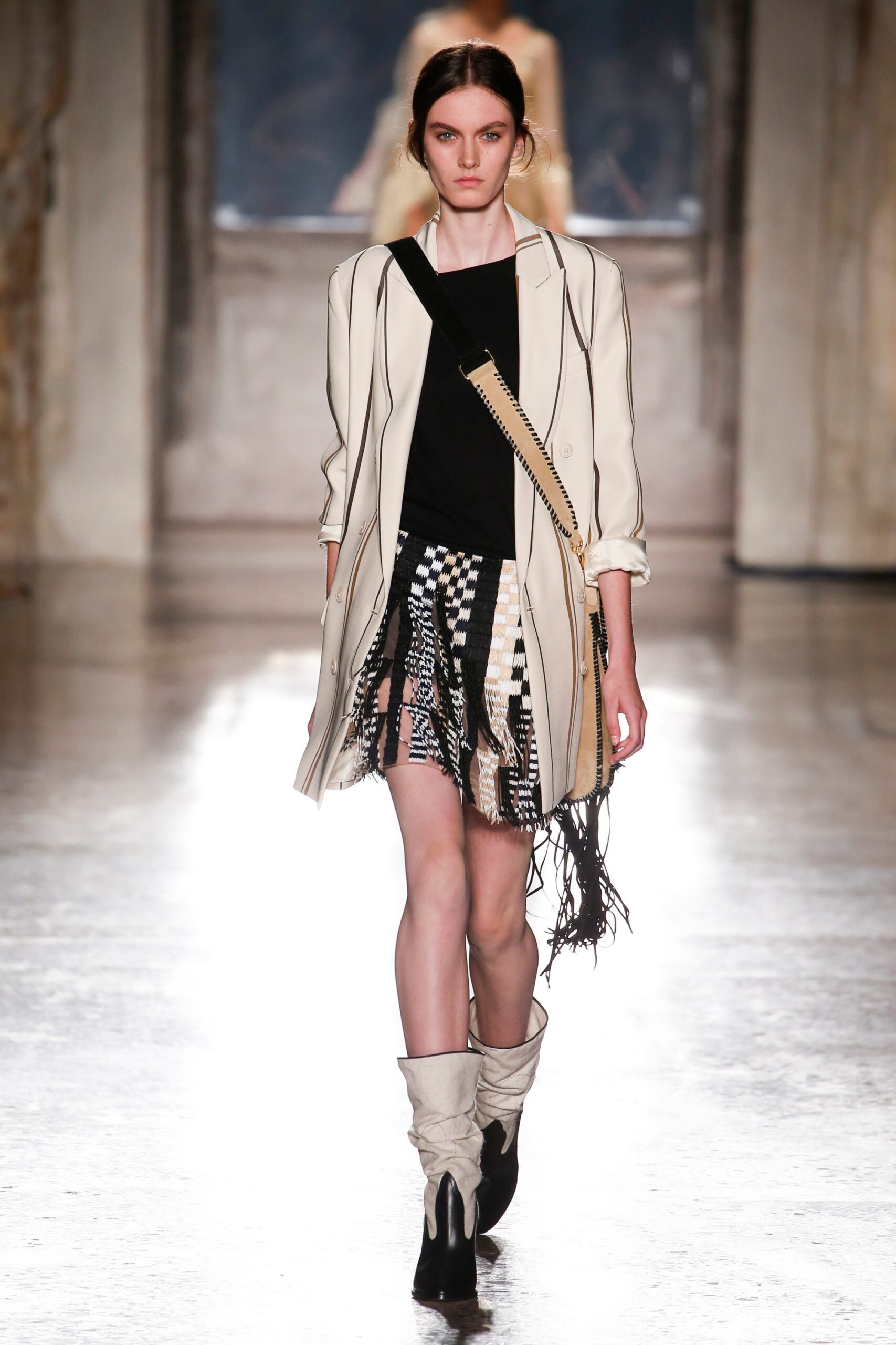 fitted white coat with fringed skirt