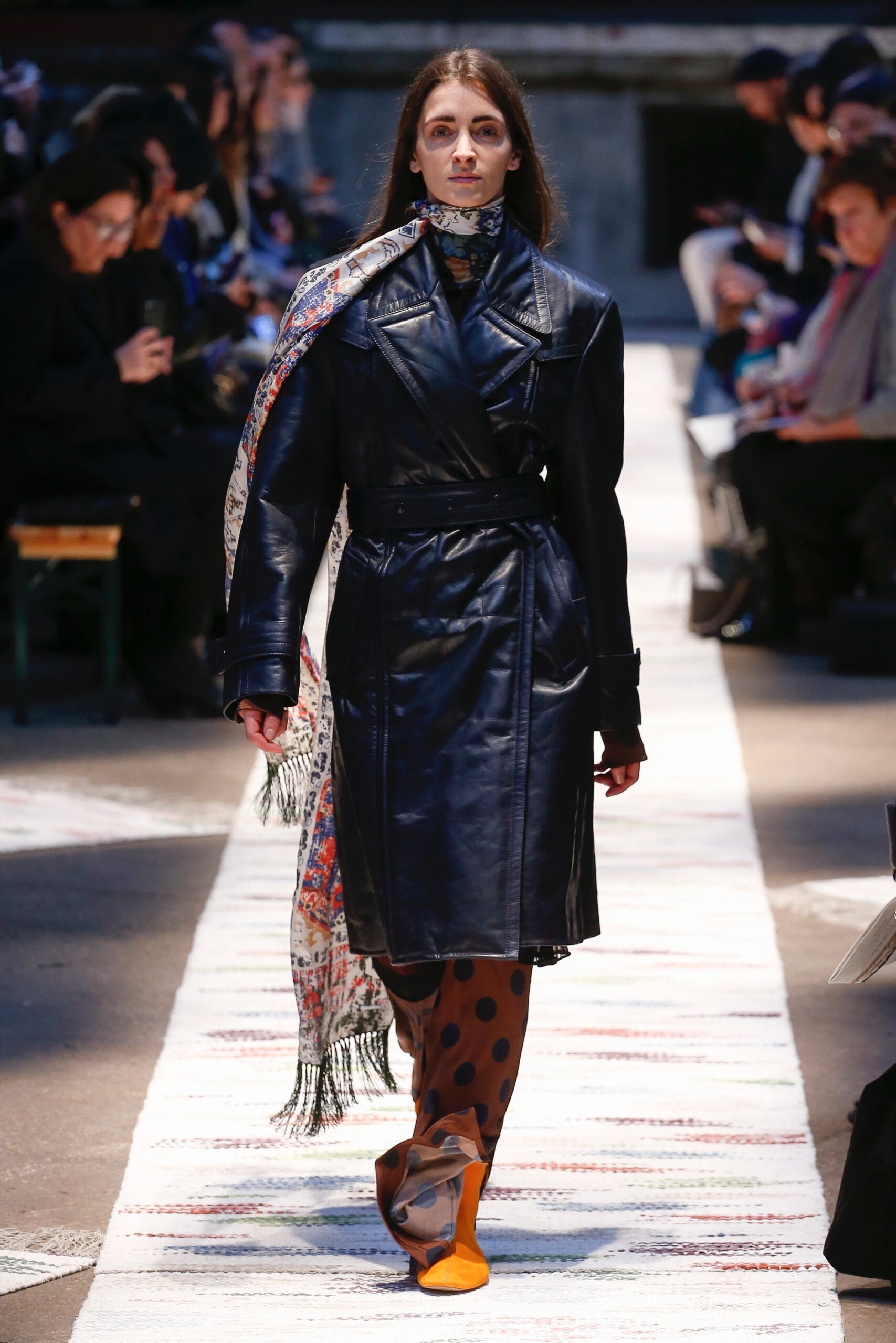 black leather coat with printed pants