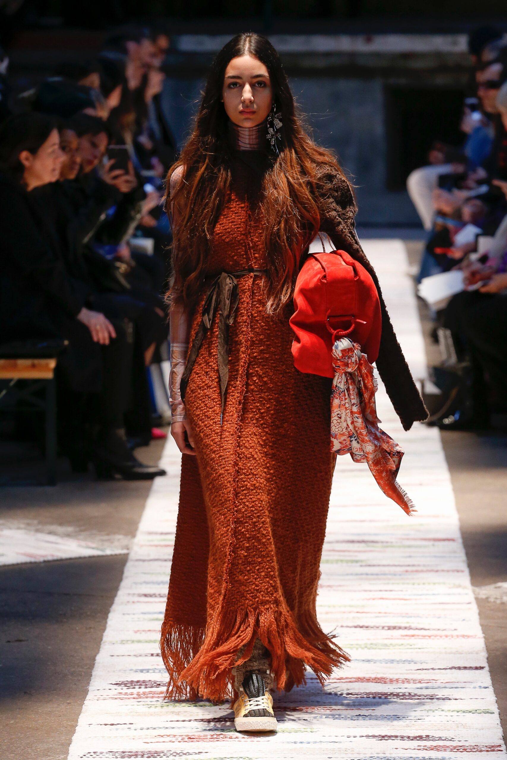 orange fringed maxi dress with red bag