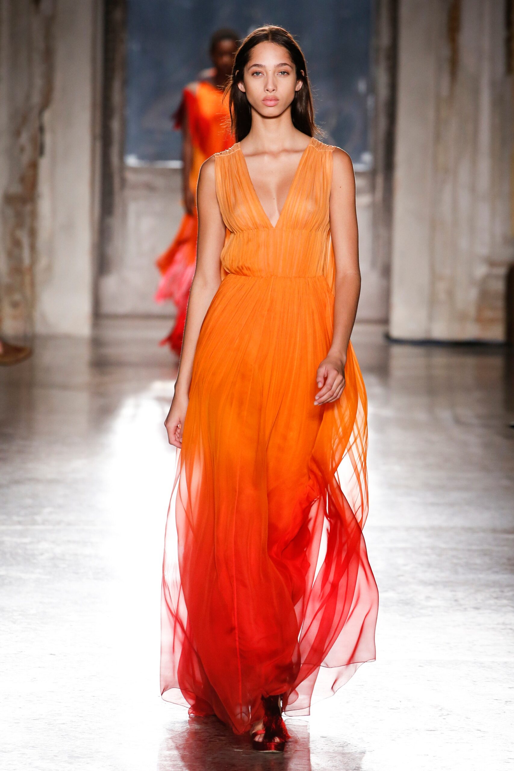 orange and red pleated gown