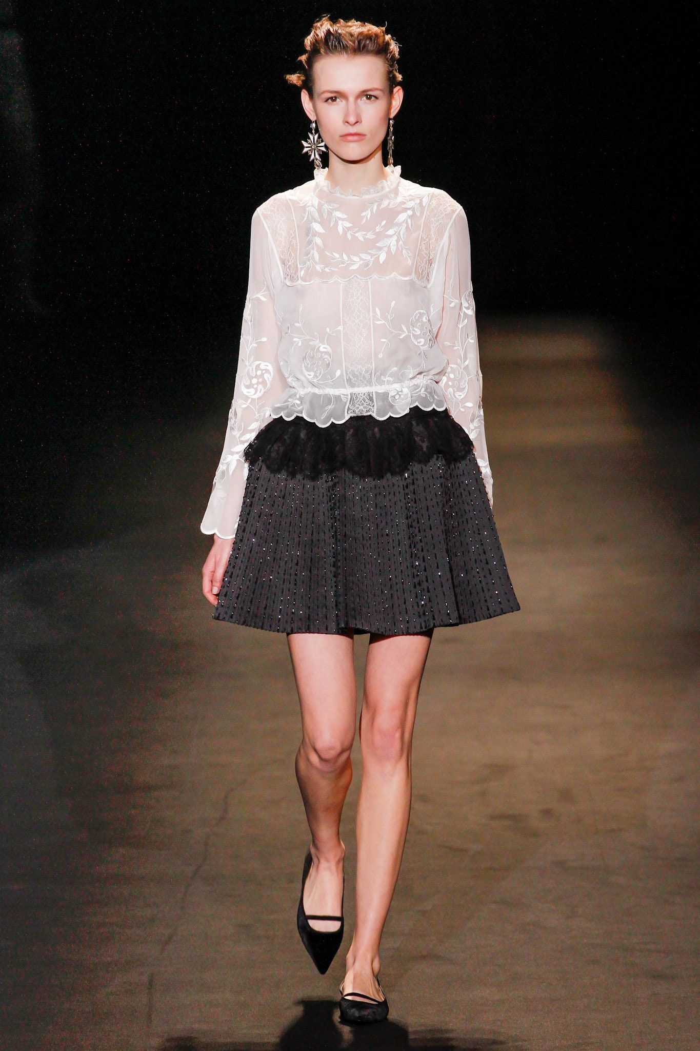 white silk blouse and black pleated skirt