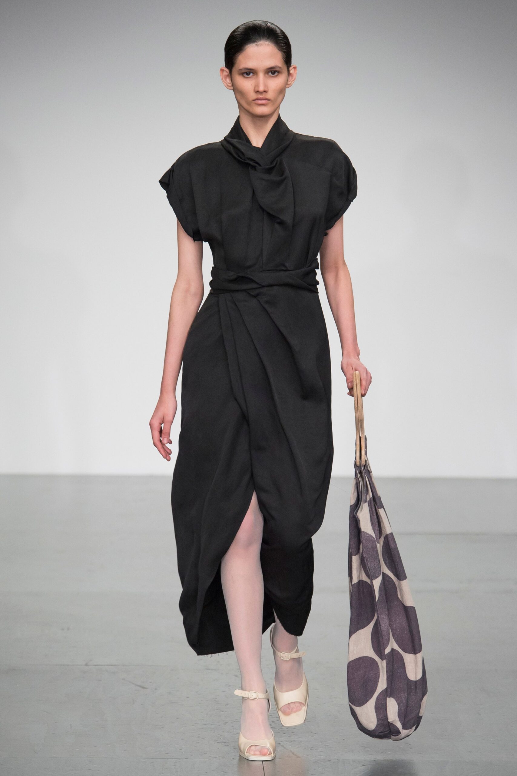 black draped midi dress with bag