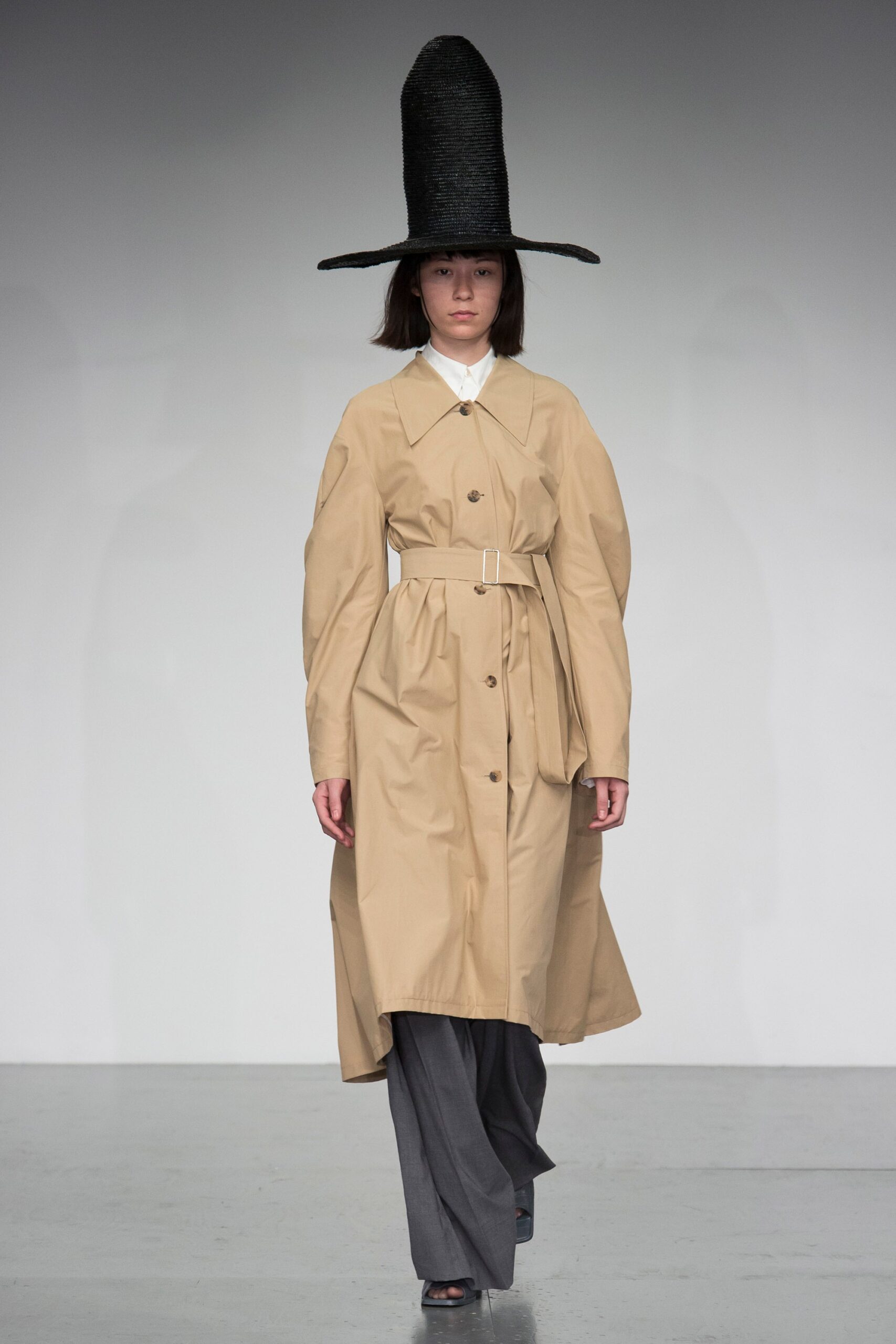 beige belted coat with gray pants