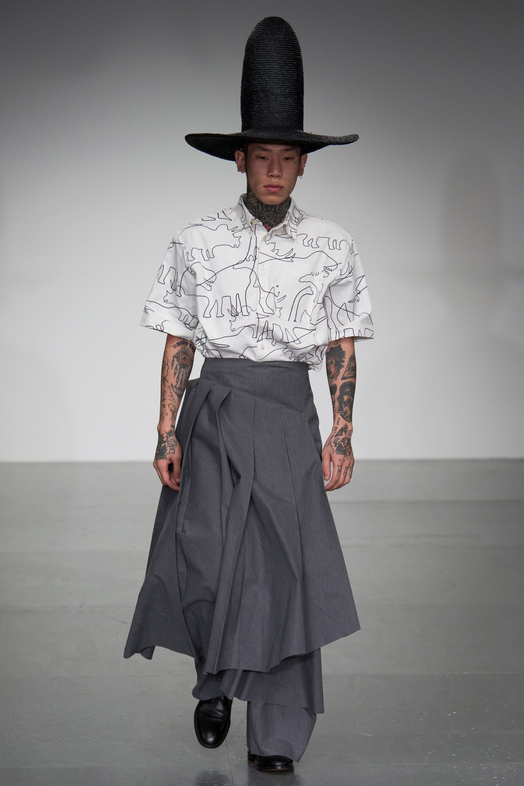 white printed shirt gray pleated skirt