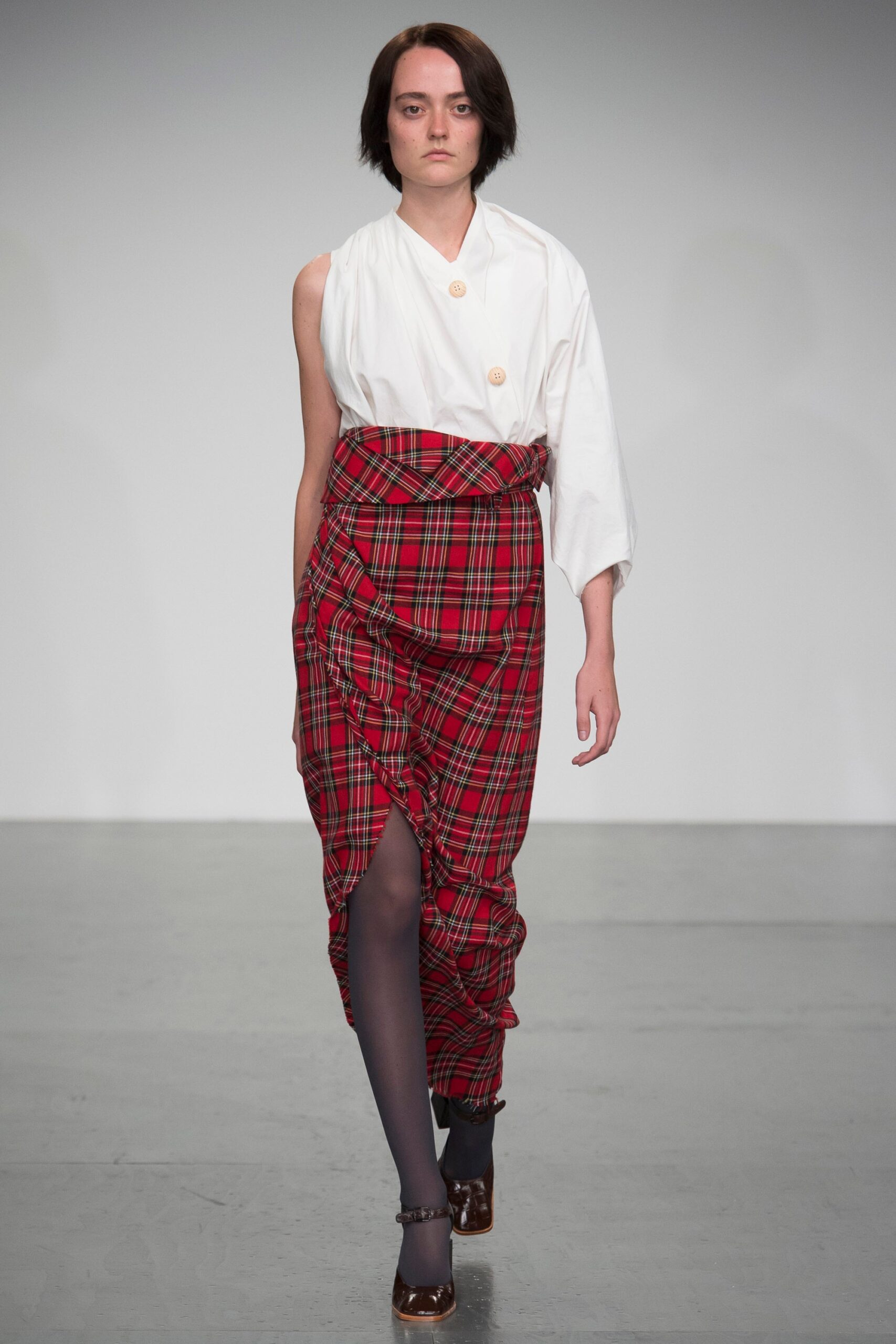 white fitted blouse and red pleated skirt