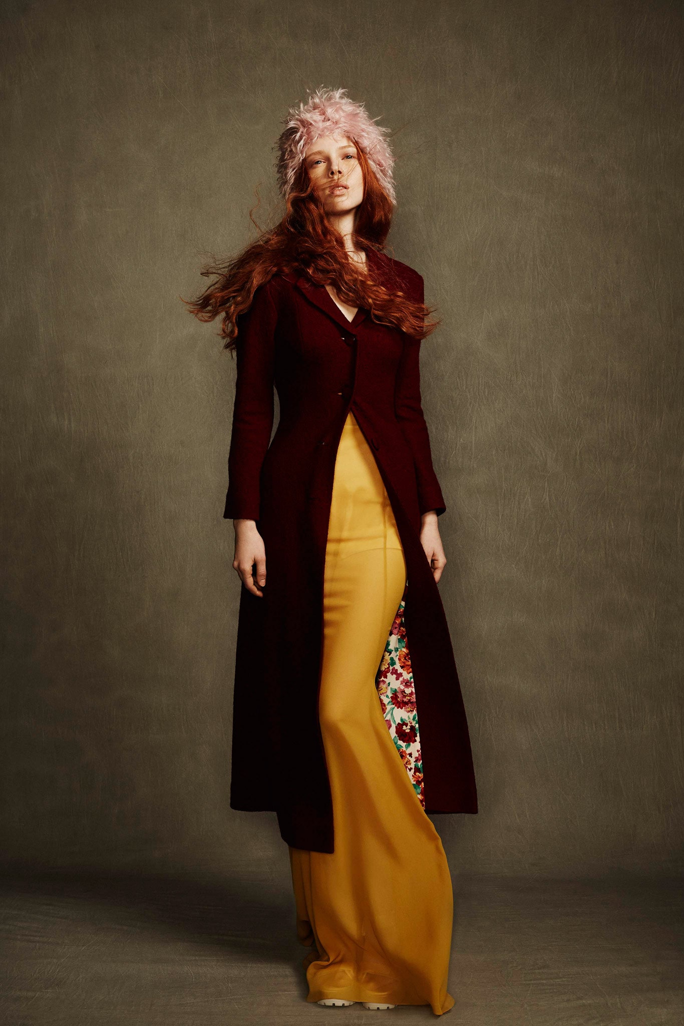 maroon coat and yellow dress