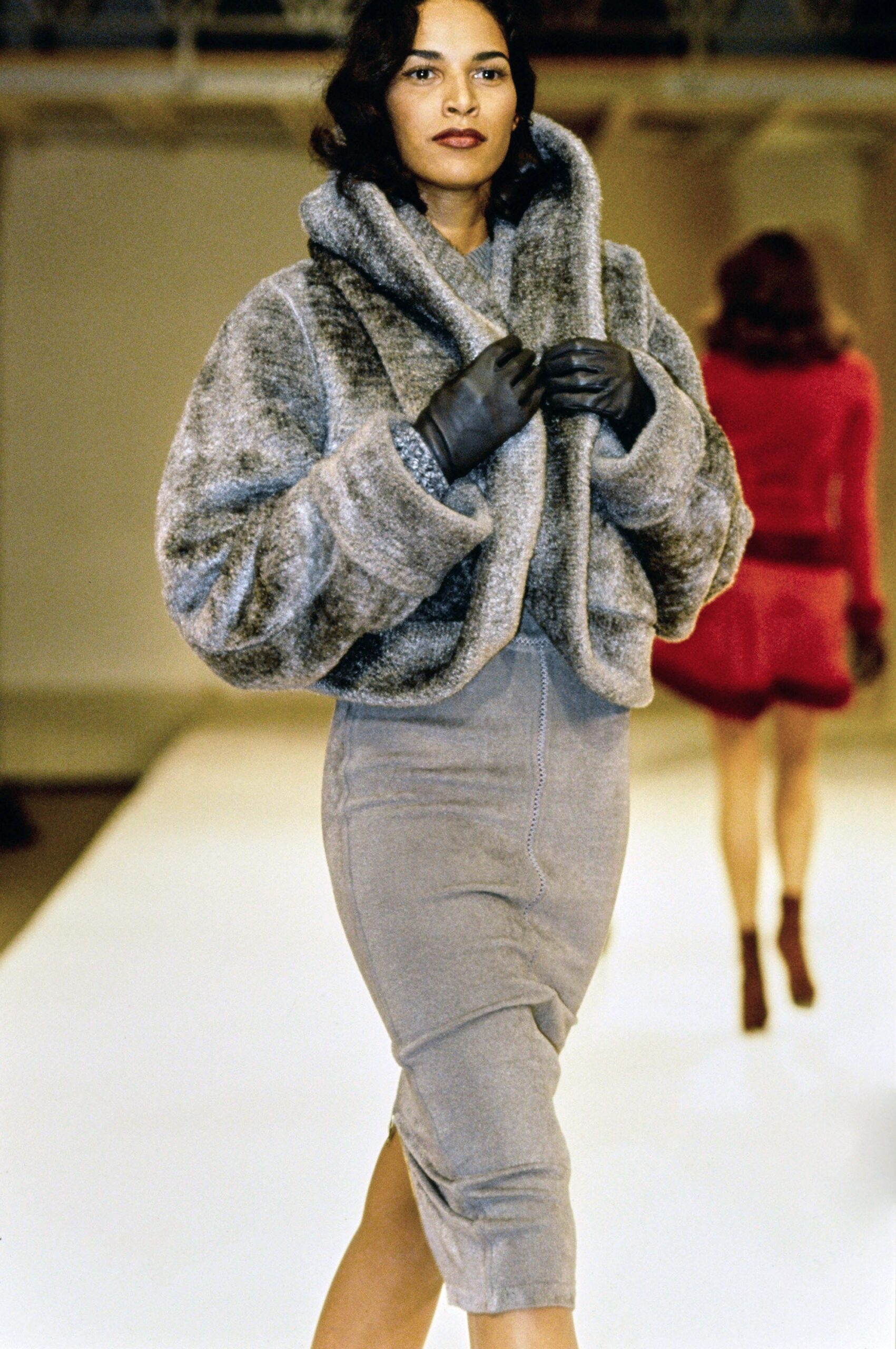 gray fur coat and suede skirt