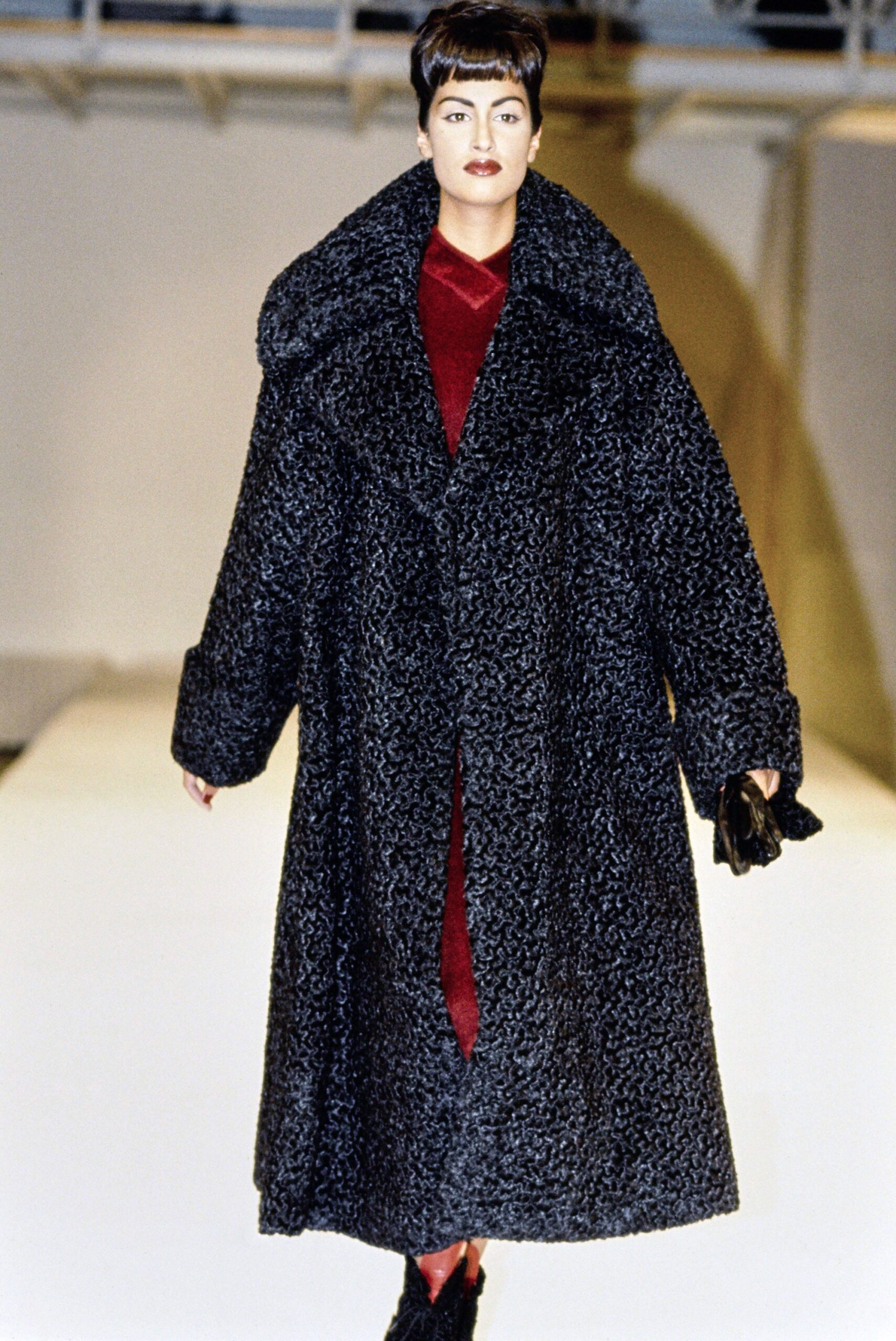 black wool coat and red silk dress