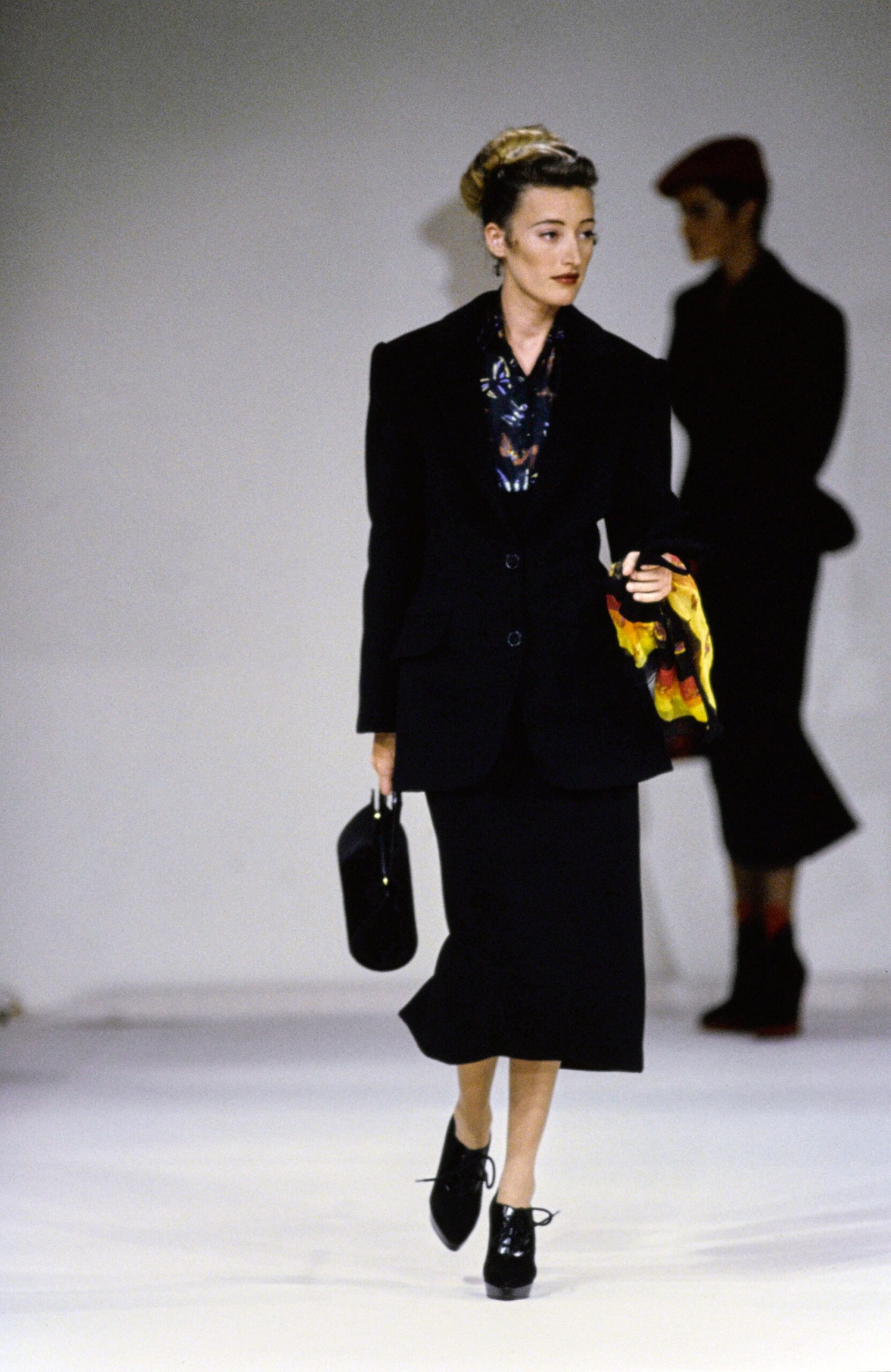 black tailored suit with printed blouse
