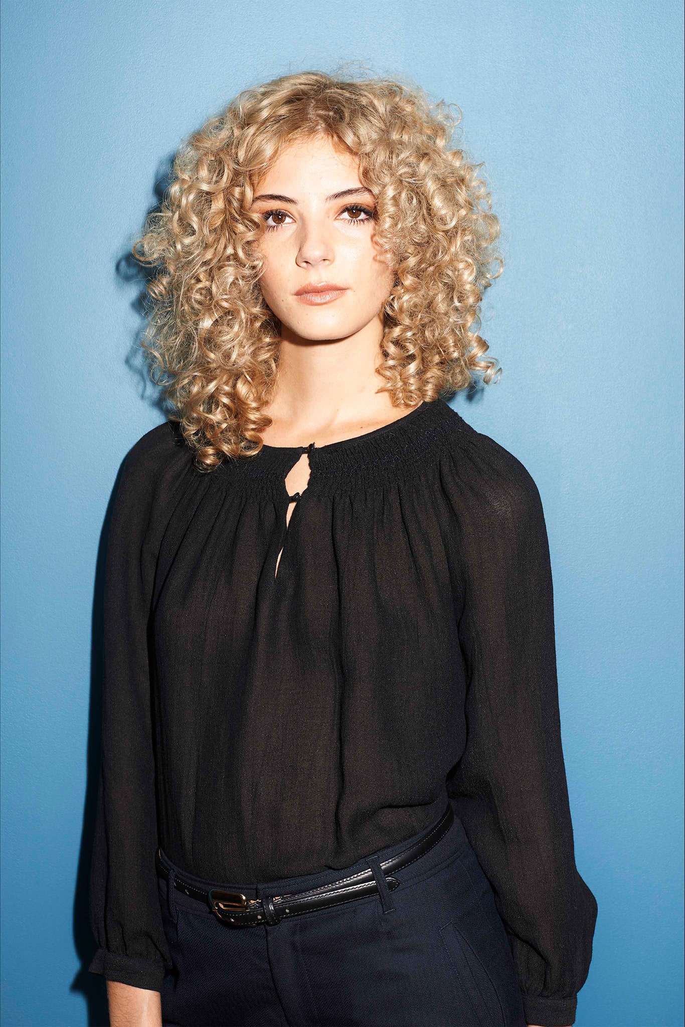 black relaxed blouse with tailored pants
