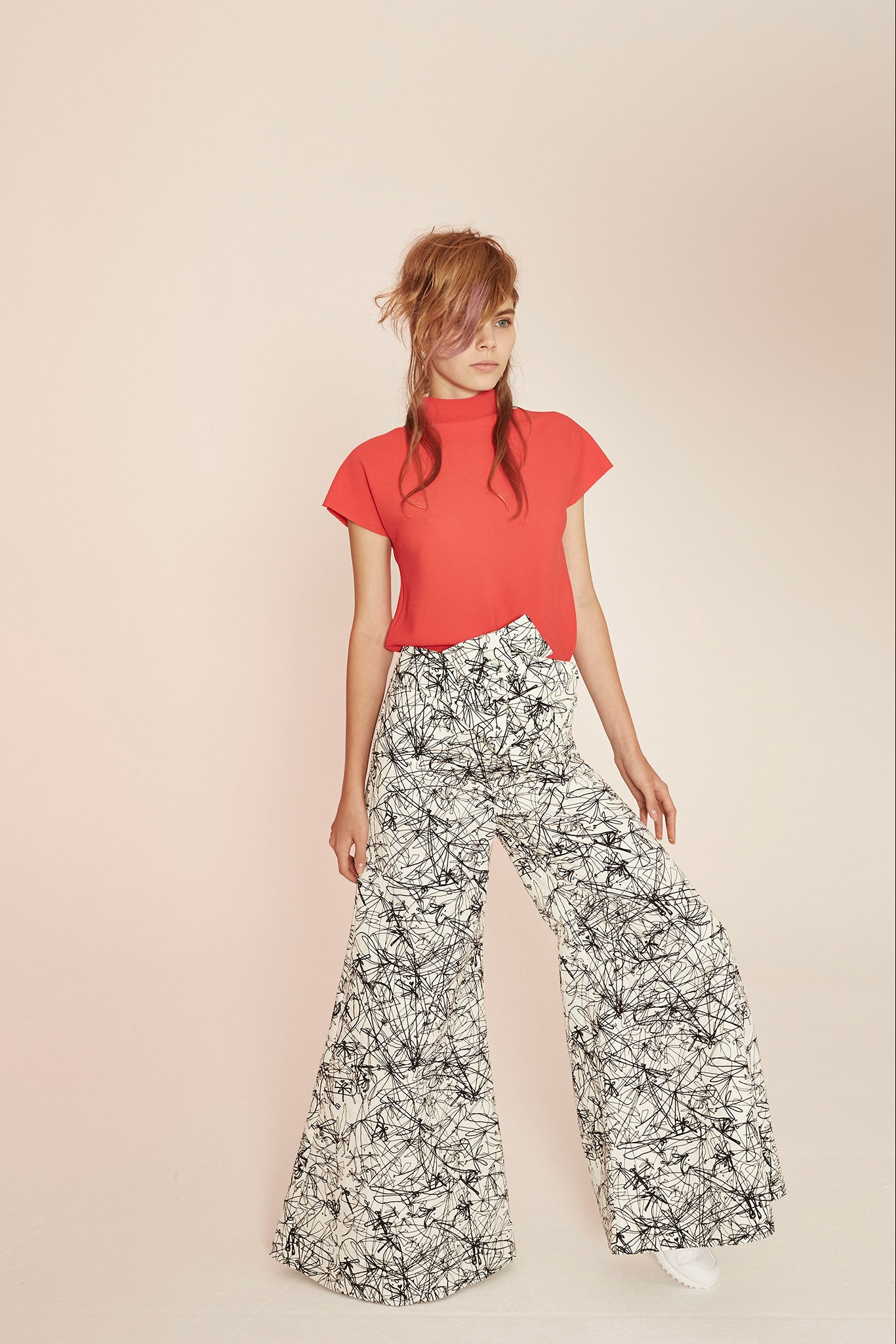 red fitted top with wide-leg pants