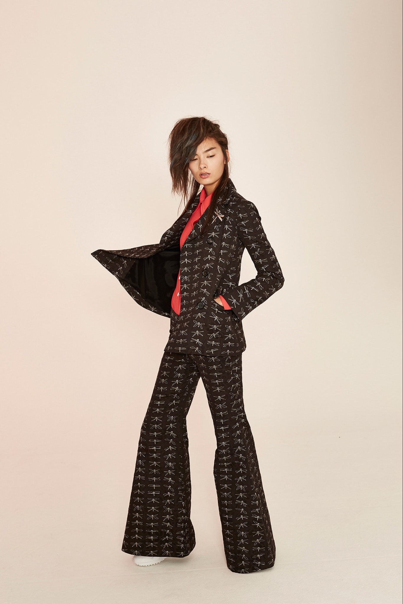 black and white printed suit with red shirt