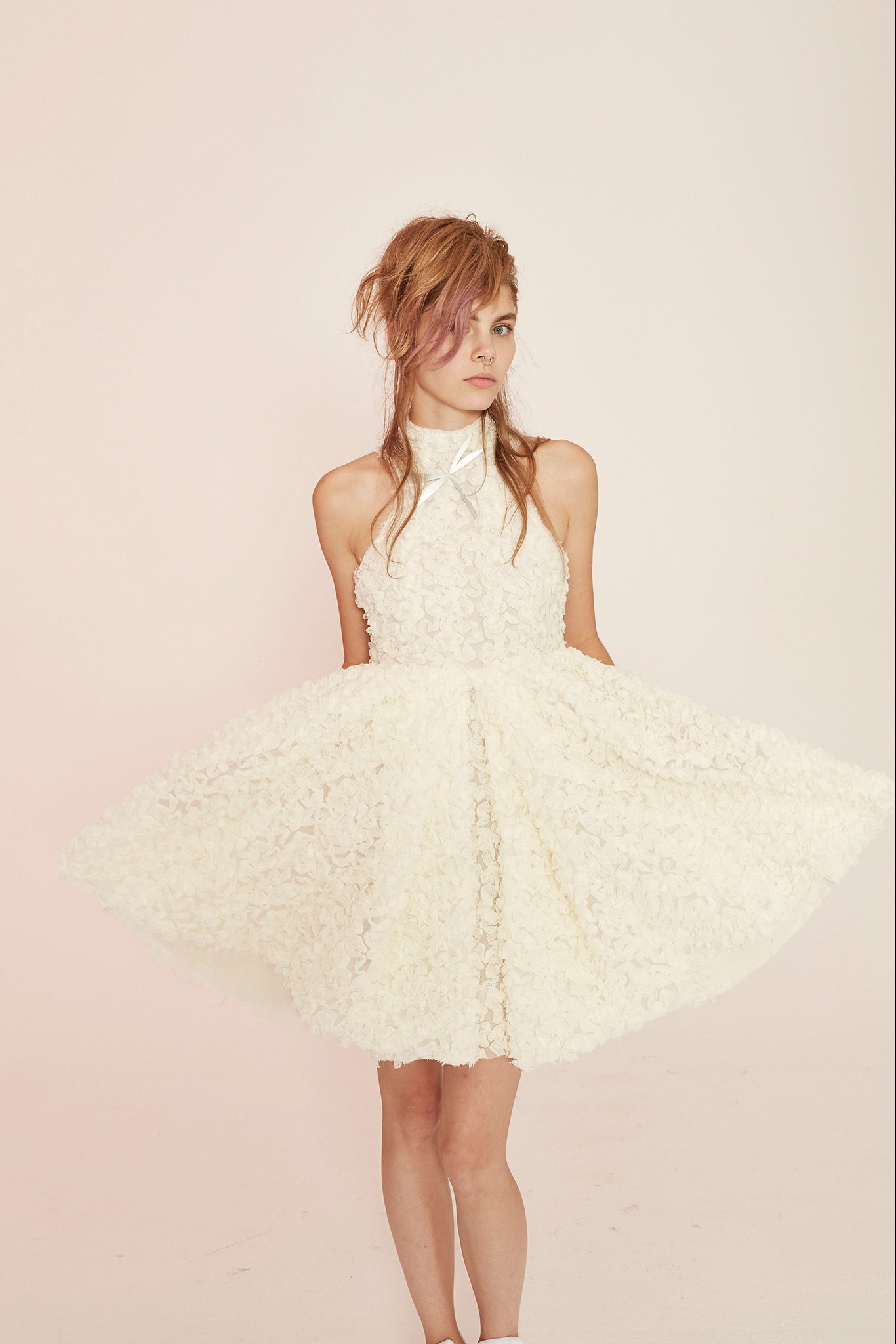 white pleated sleeveless dress