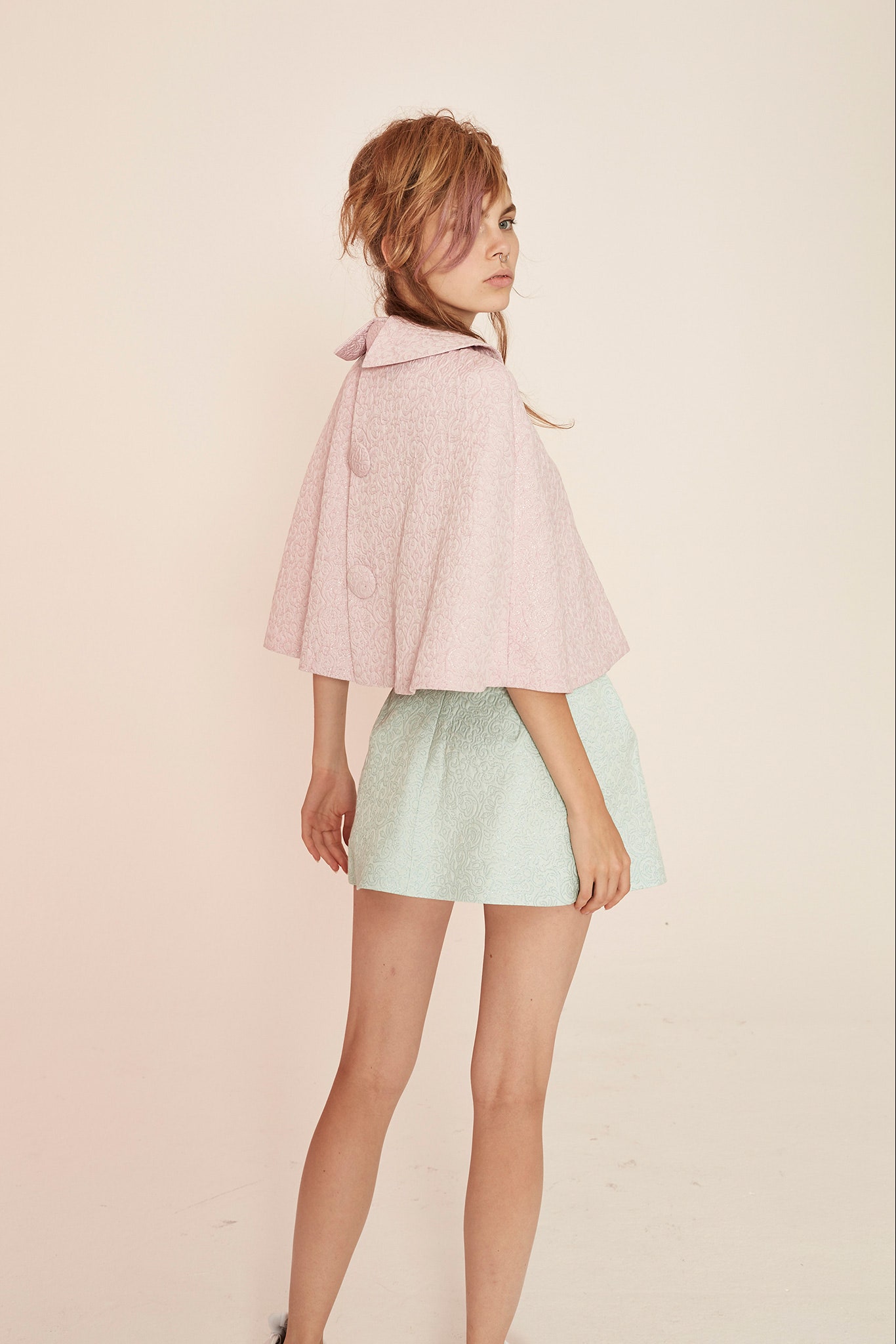 pink cape and mint skirt