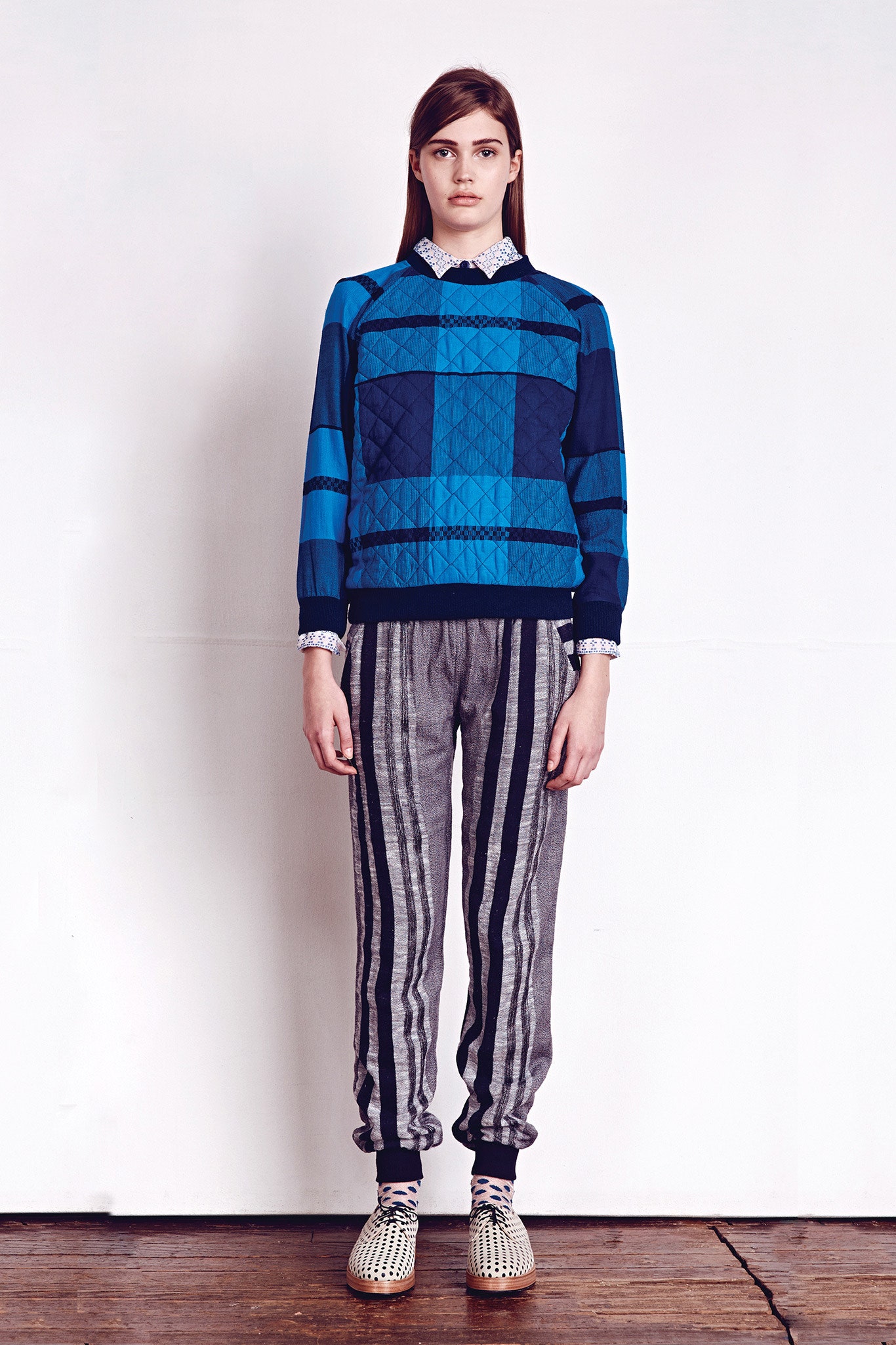 blue printed sweater and gray striped pants