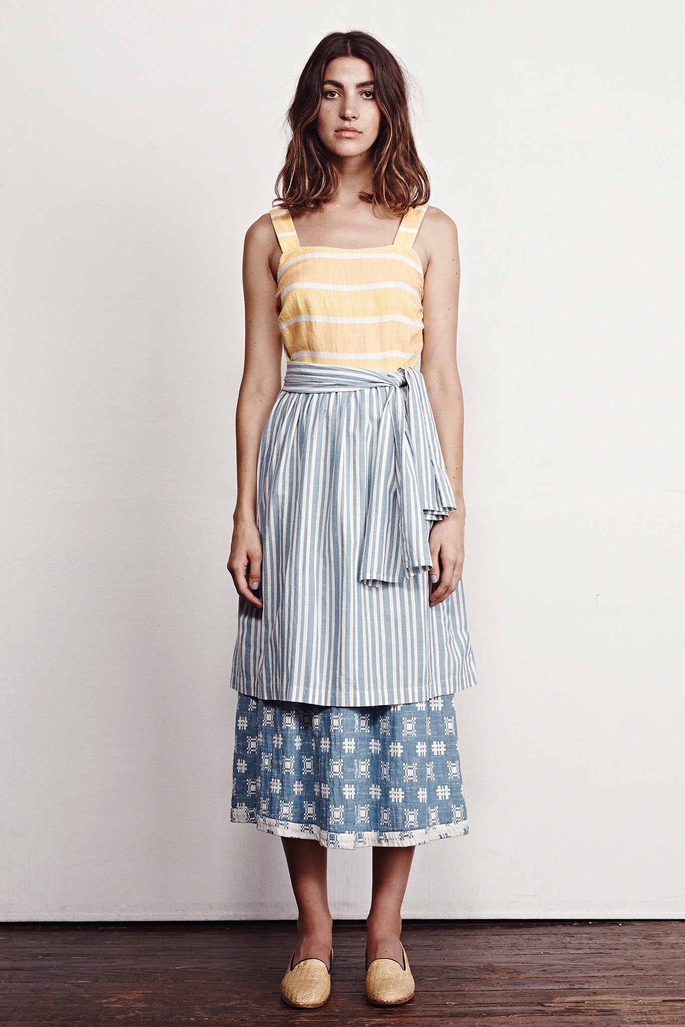 yellow striped top with blue skirt