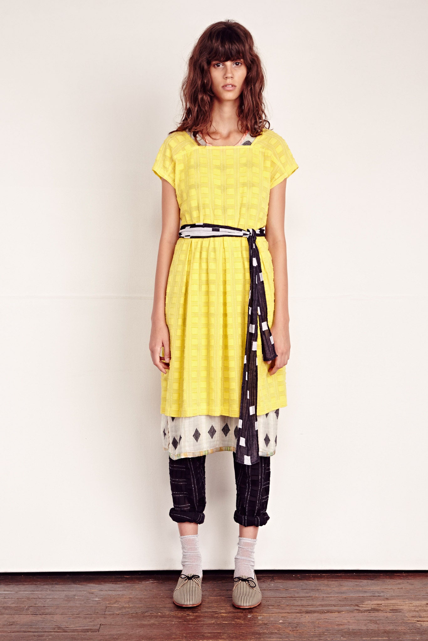 yellow pleated midi dress with relaxed pants