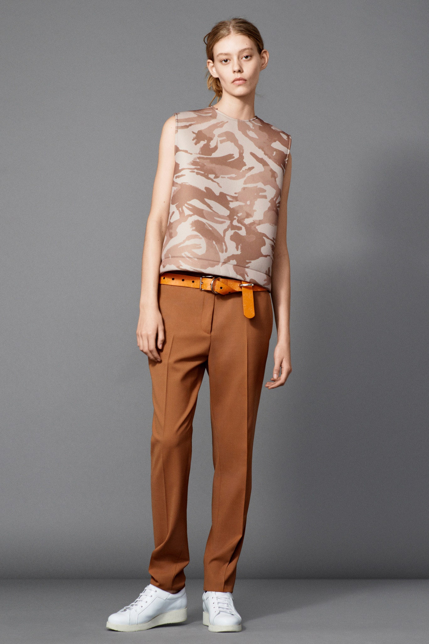 beige camouflage sleeveless top with brown tailored pants