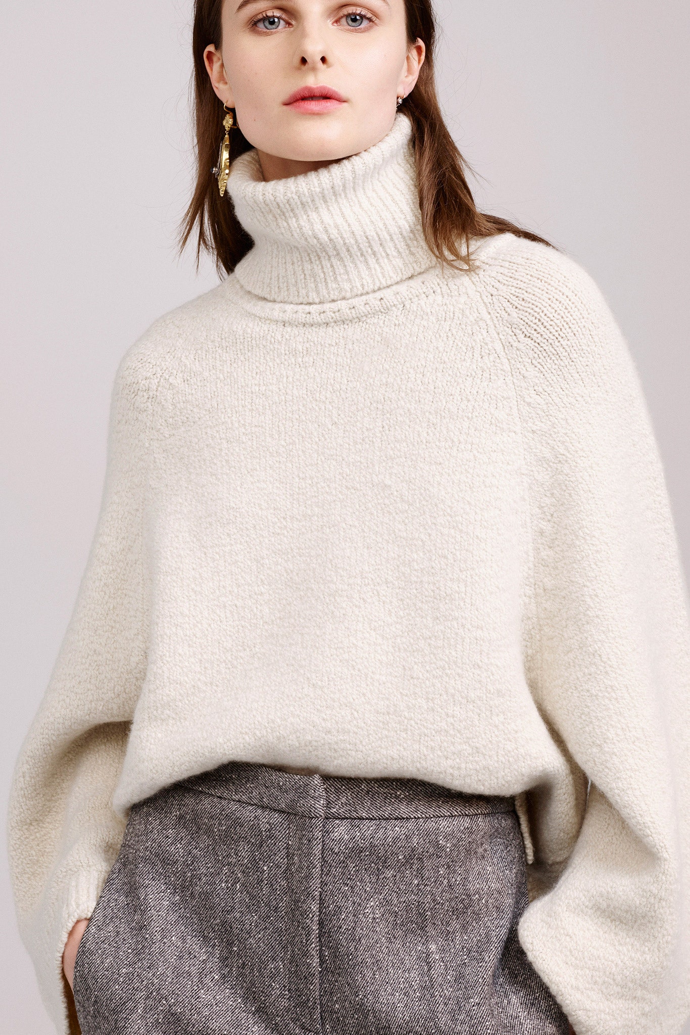oversized white wool sweater and gray pants