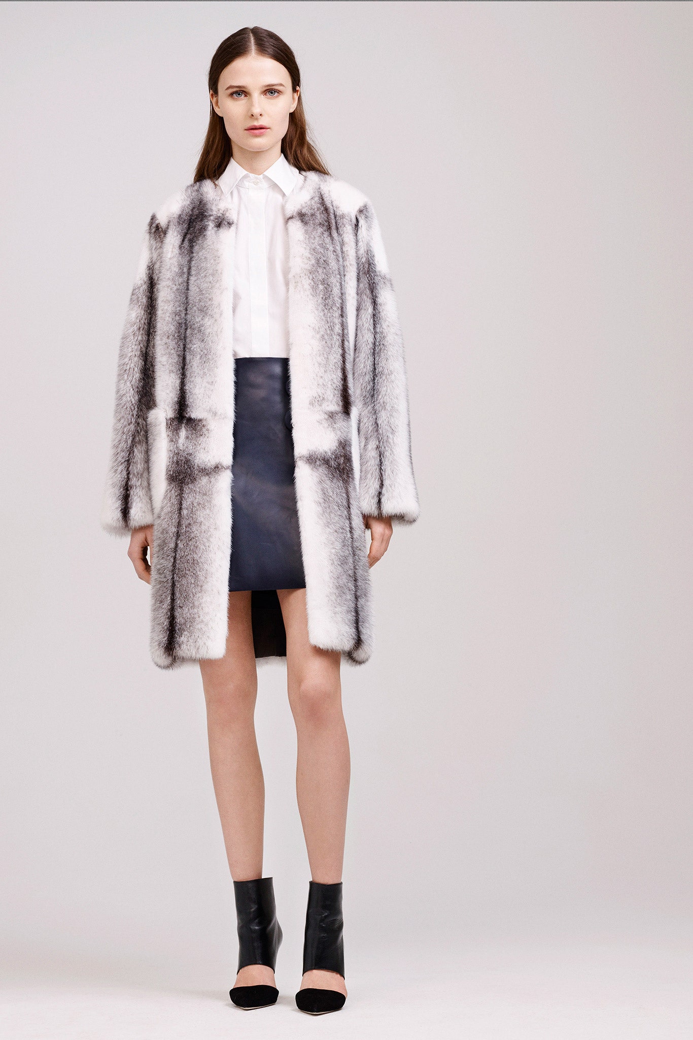 gray faux-fur coat with black skirt