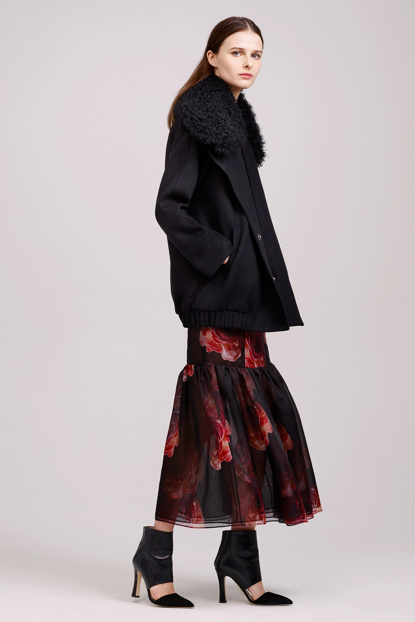 black wool coat and tiered skirt