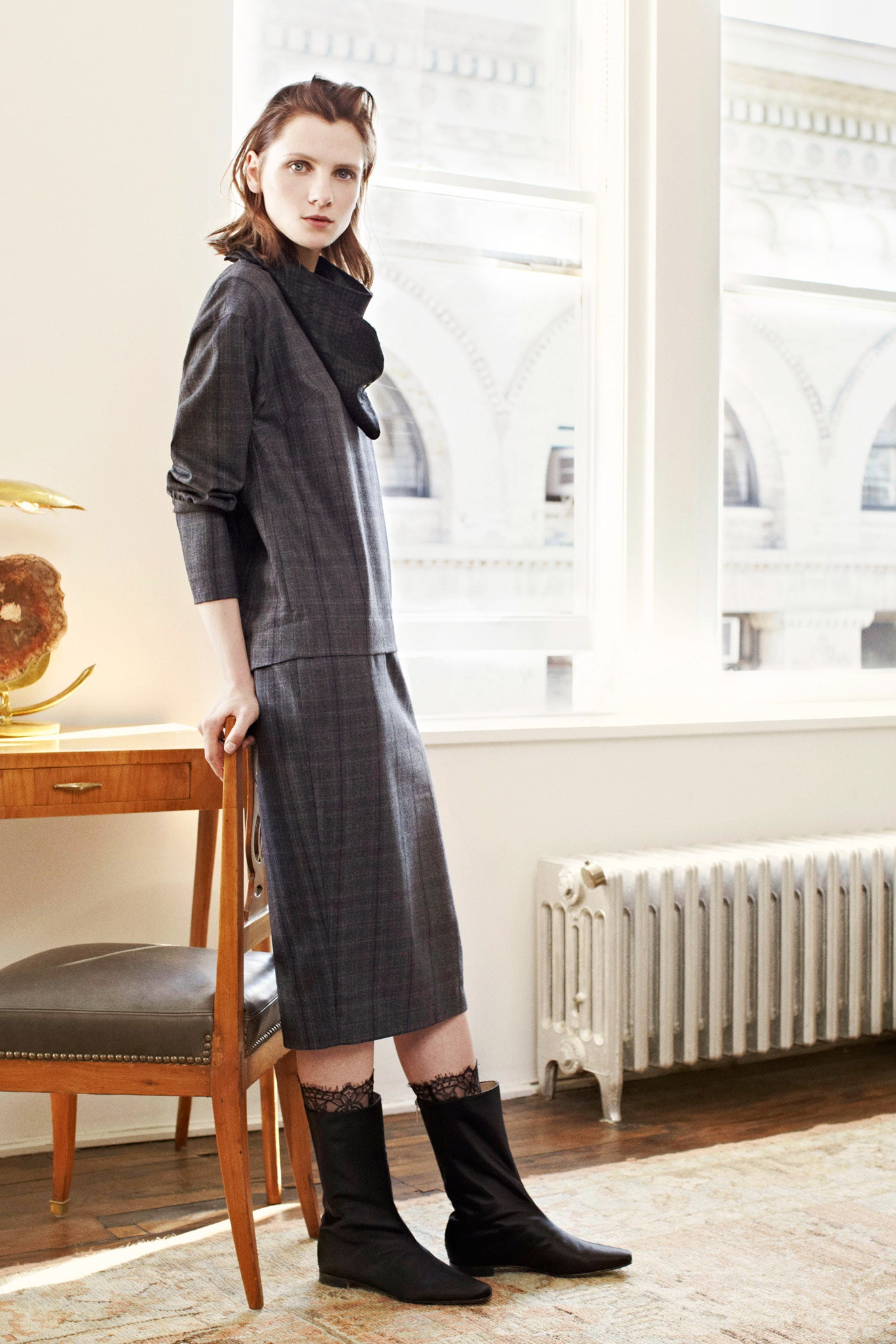 gray fitted midi dress with black boots