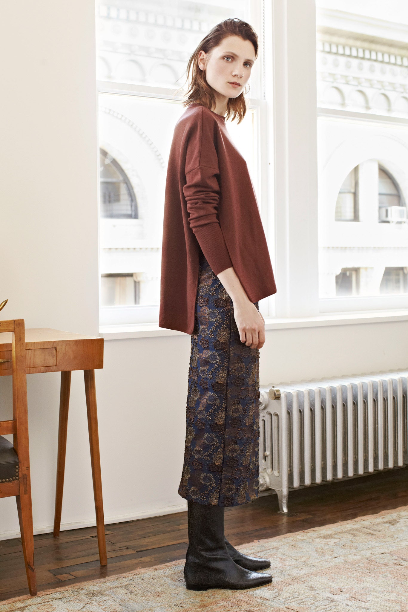 brown oversized top with blue midi skirt