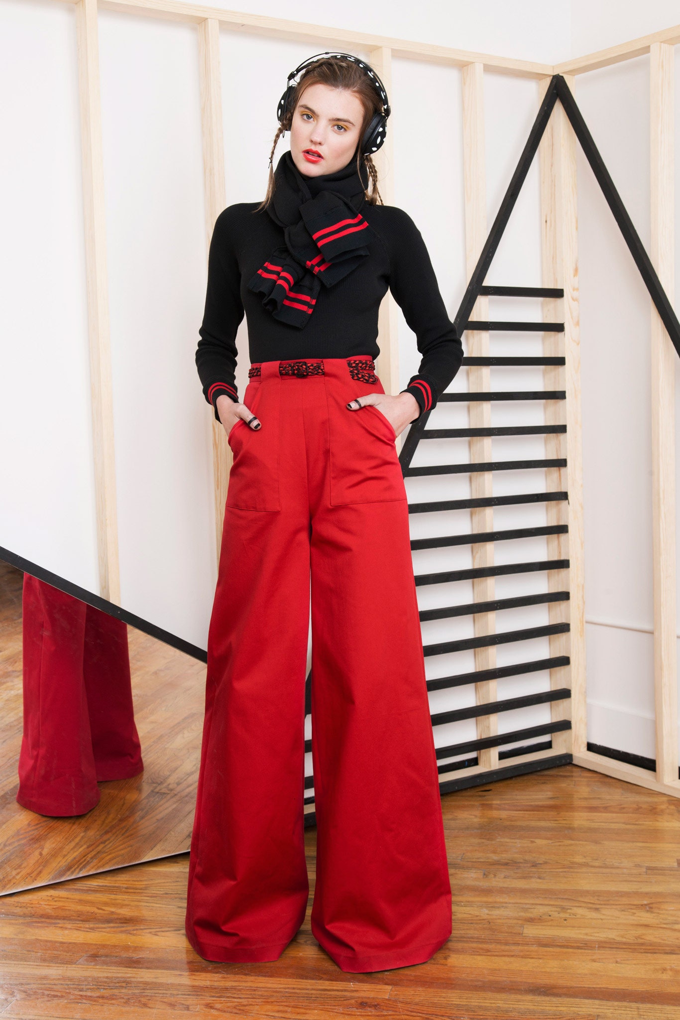 black fitted top red wide-leg pants