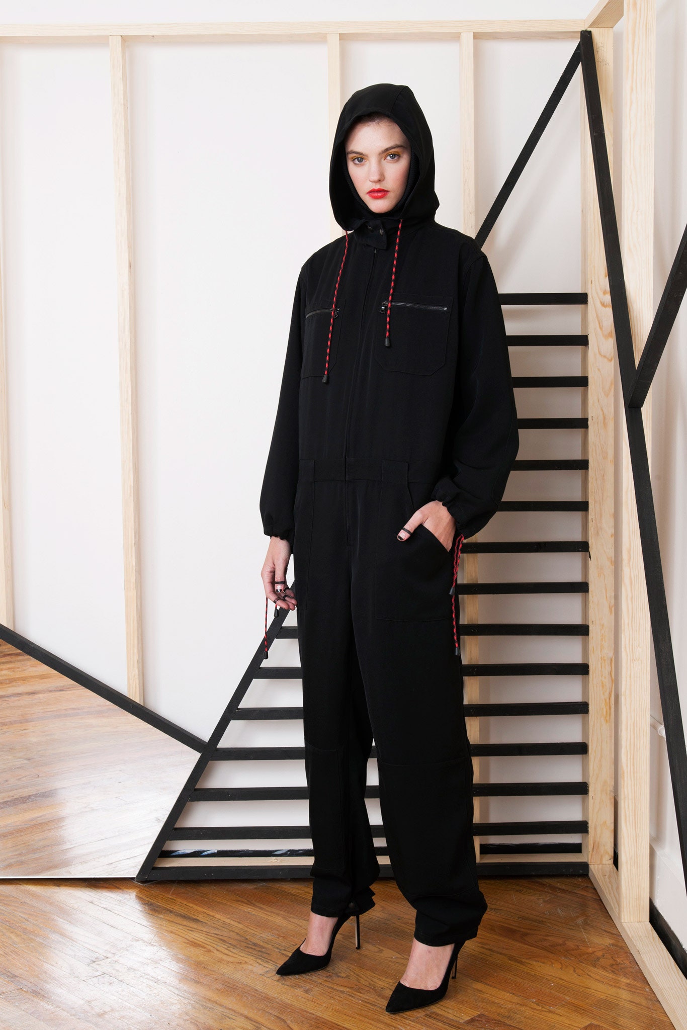 black relaxed hooded jumpsuit with heels