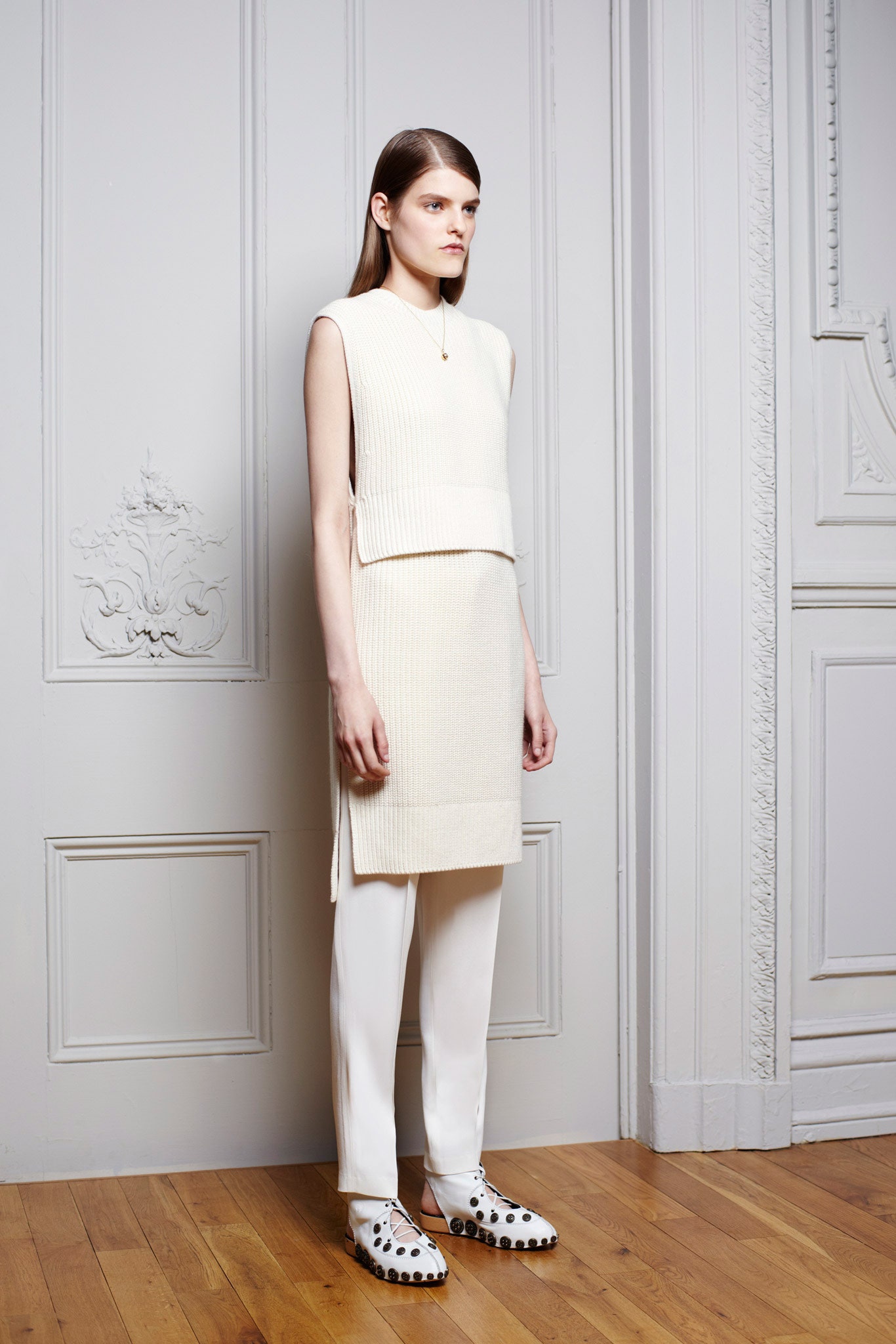white fitted knit top with tailored pants