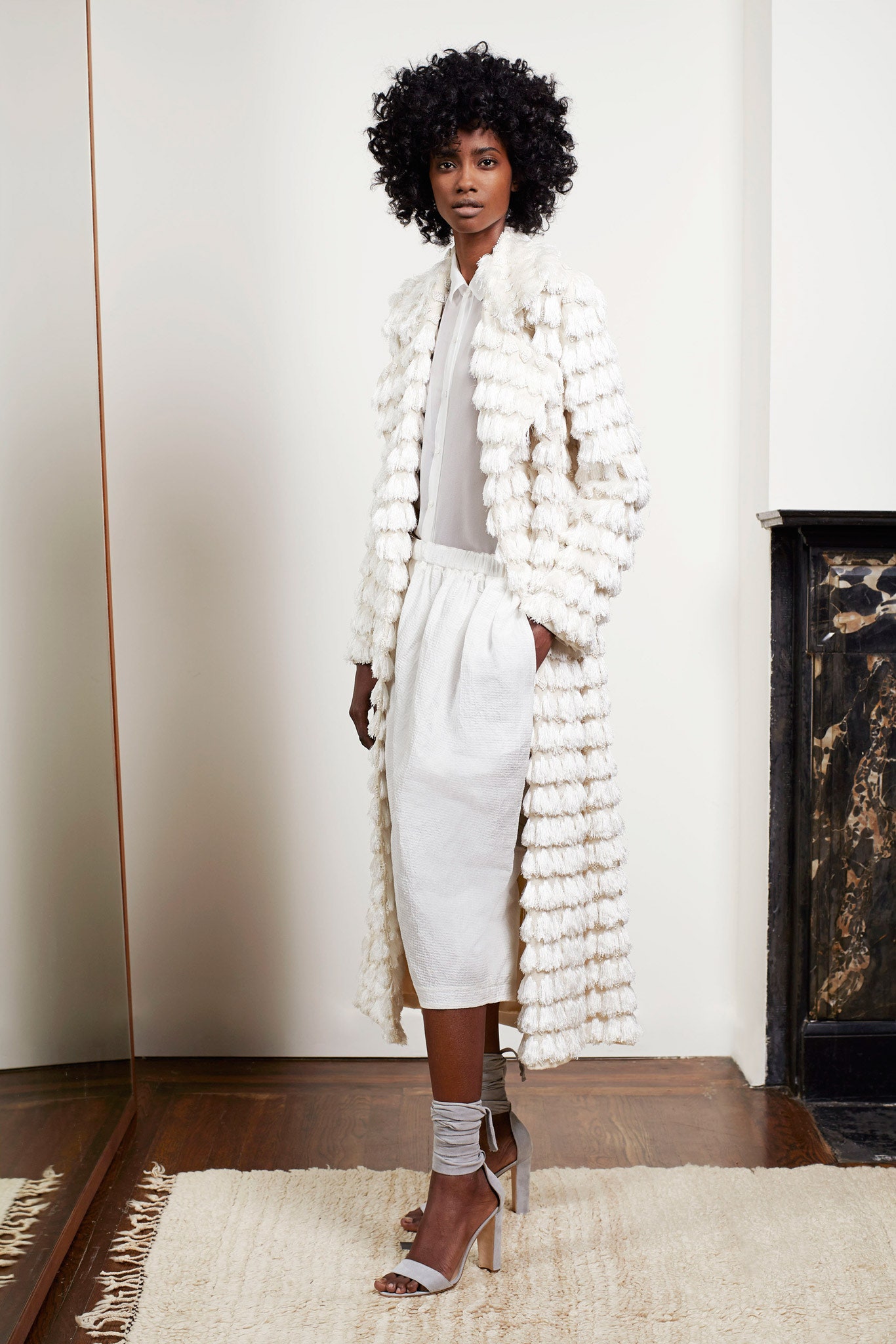 white cotton long-sleeve collared relaxed layered coat
