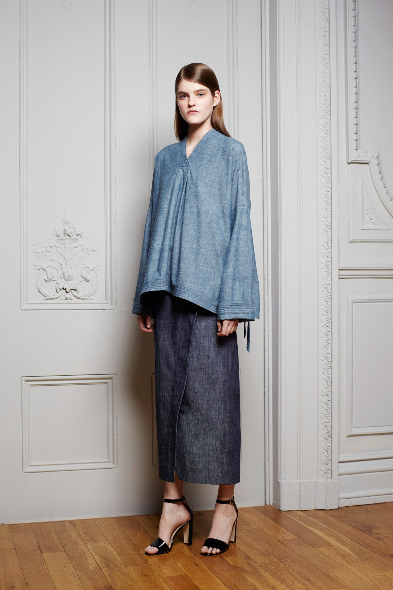 blue relaxed top with gray pants