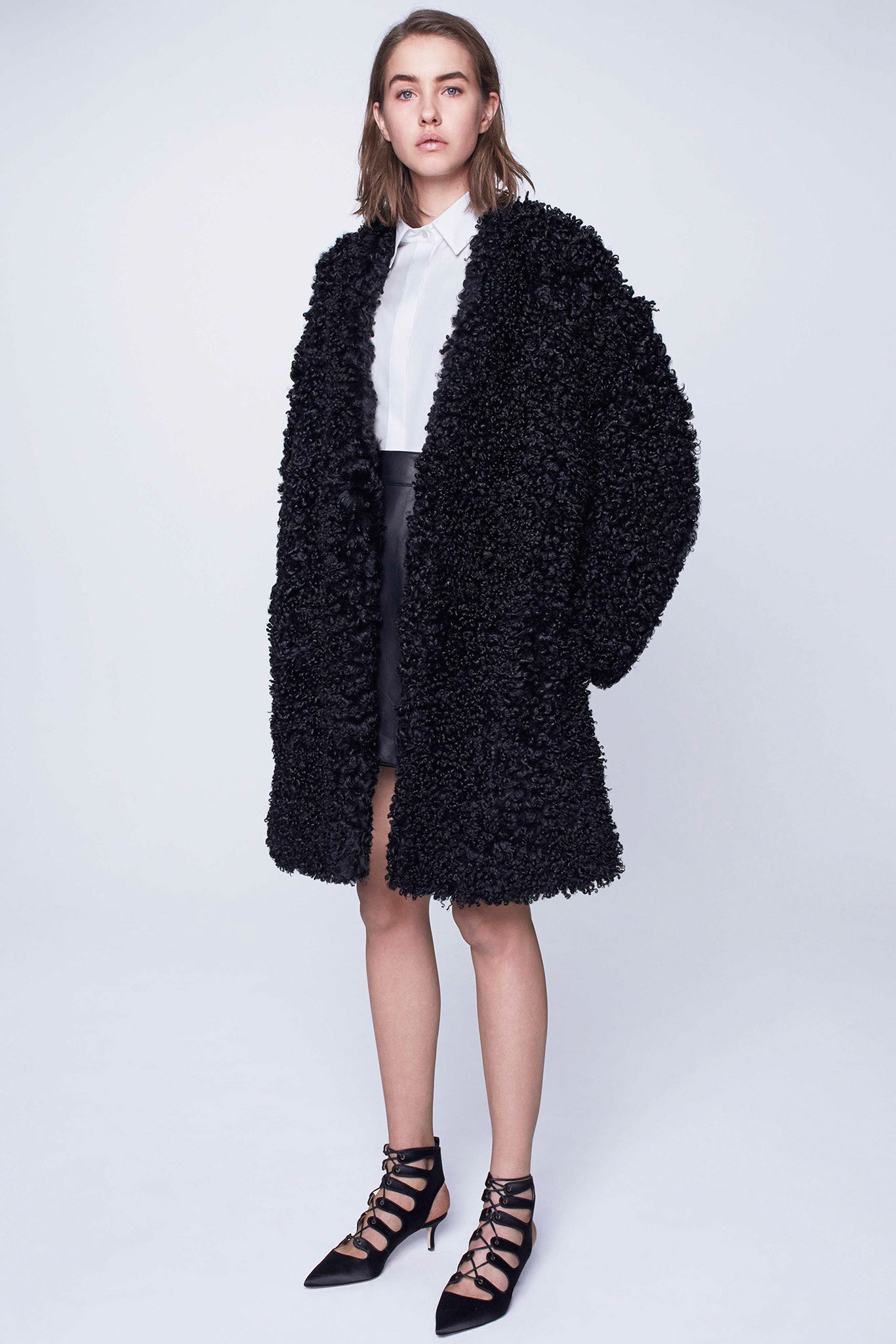 black faux-fur coat with white shirt