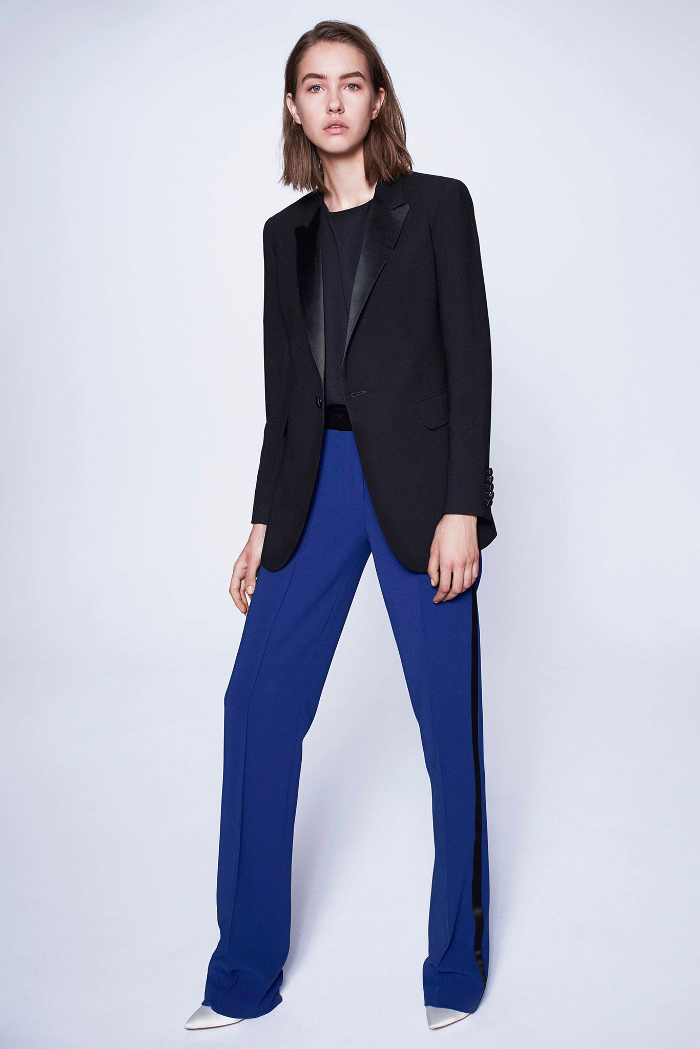 black tailored blazer with blue pants