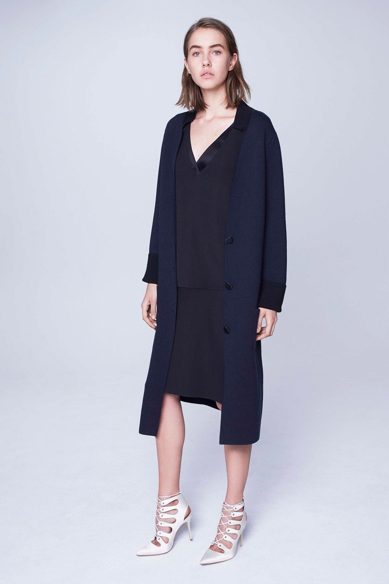 black silk sleeveless dress with navy coat