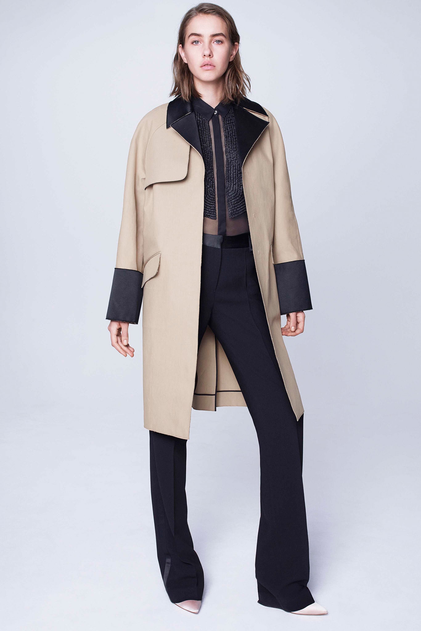 beige coat black blouse black pants