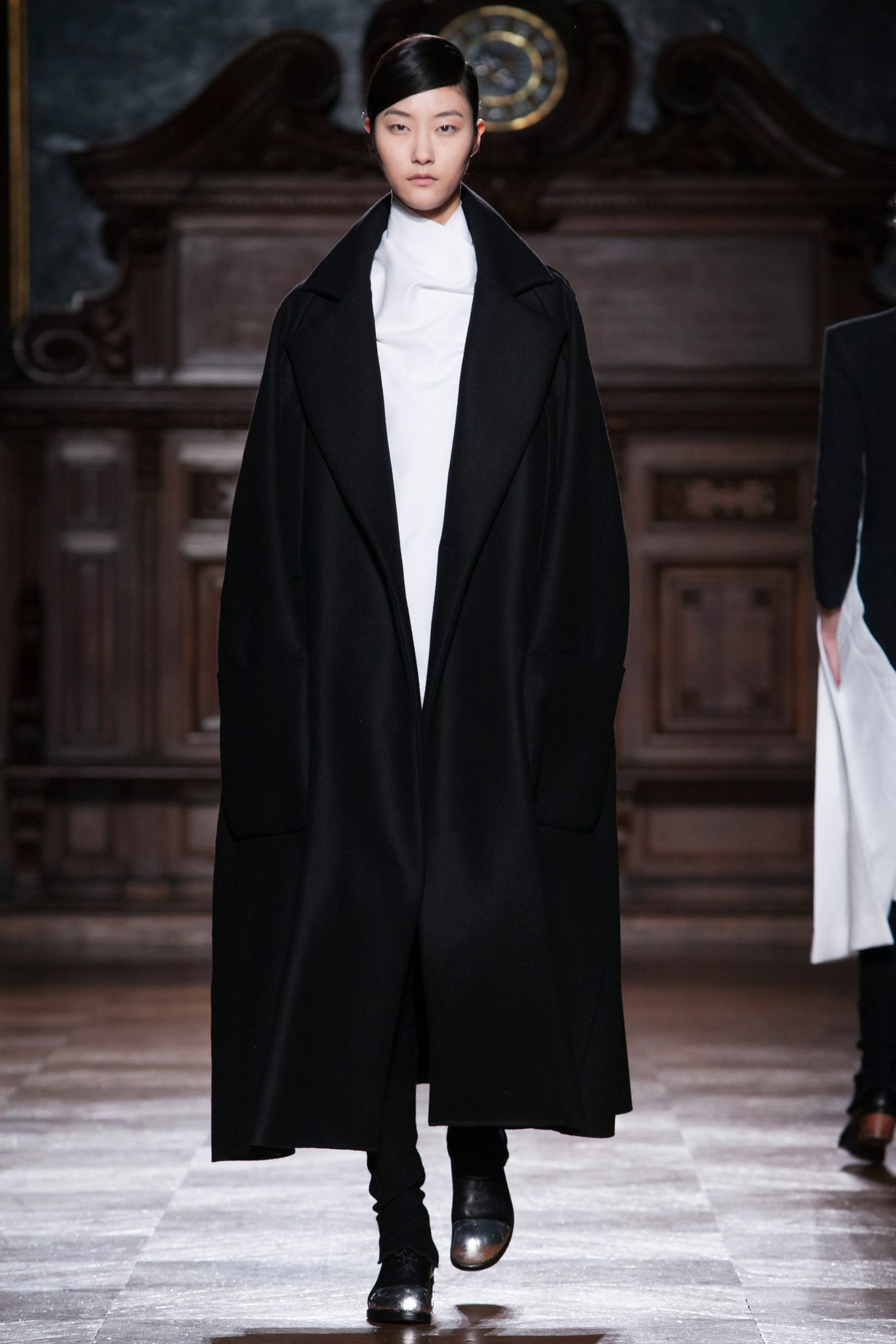 black oversized coat and white fitted top