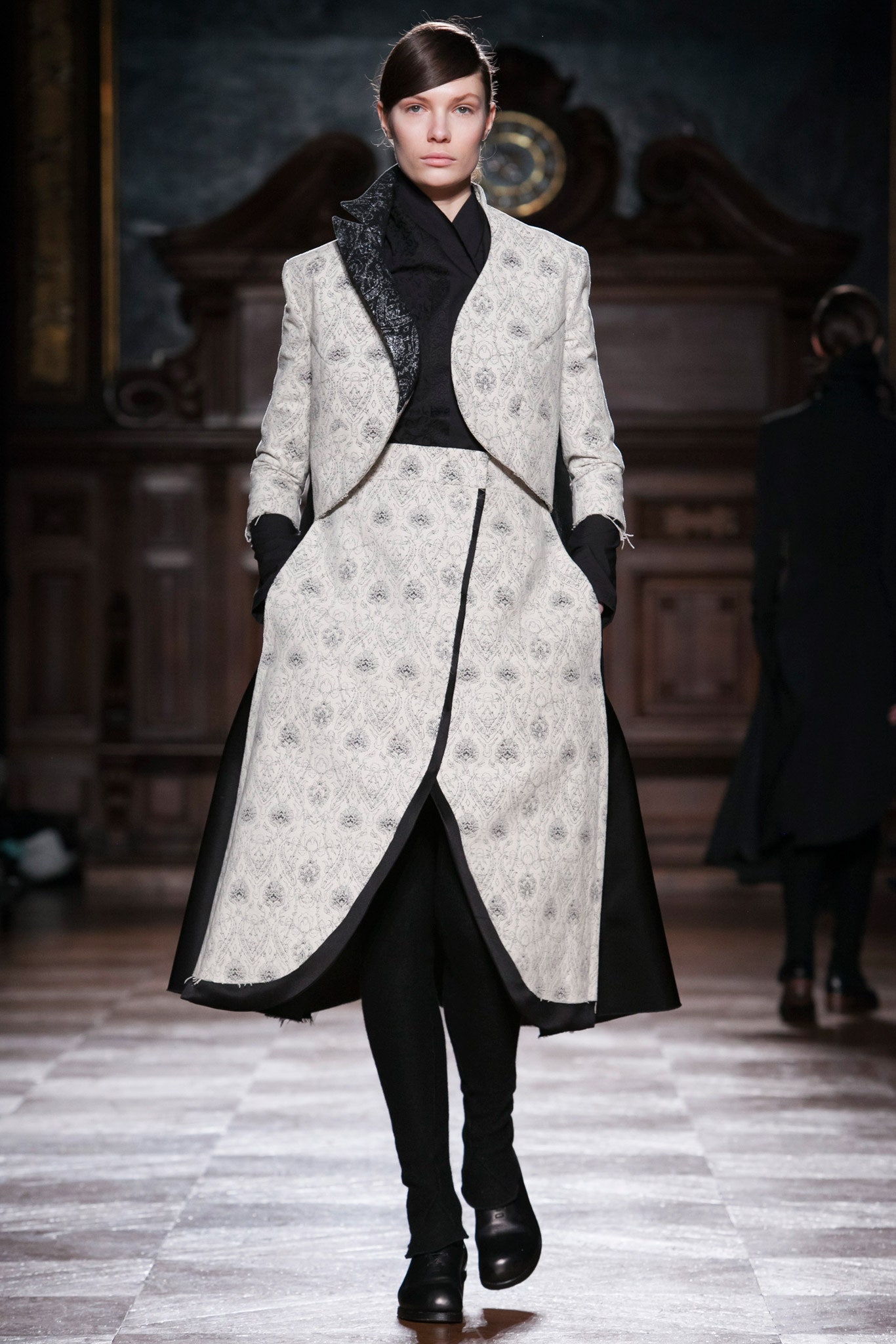white embroidered coat and black dress